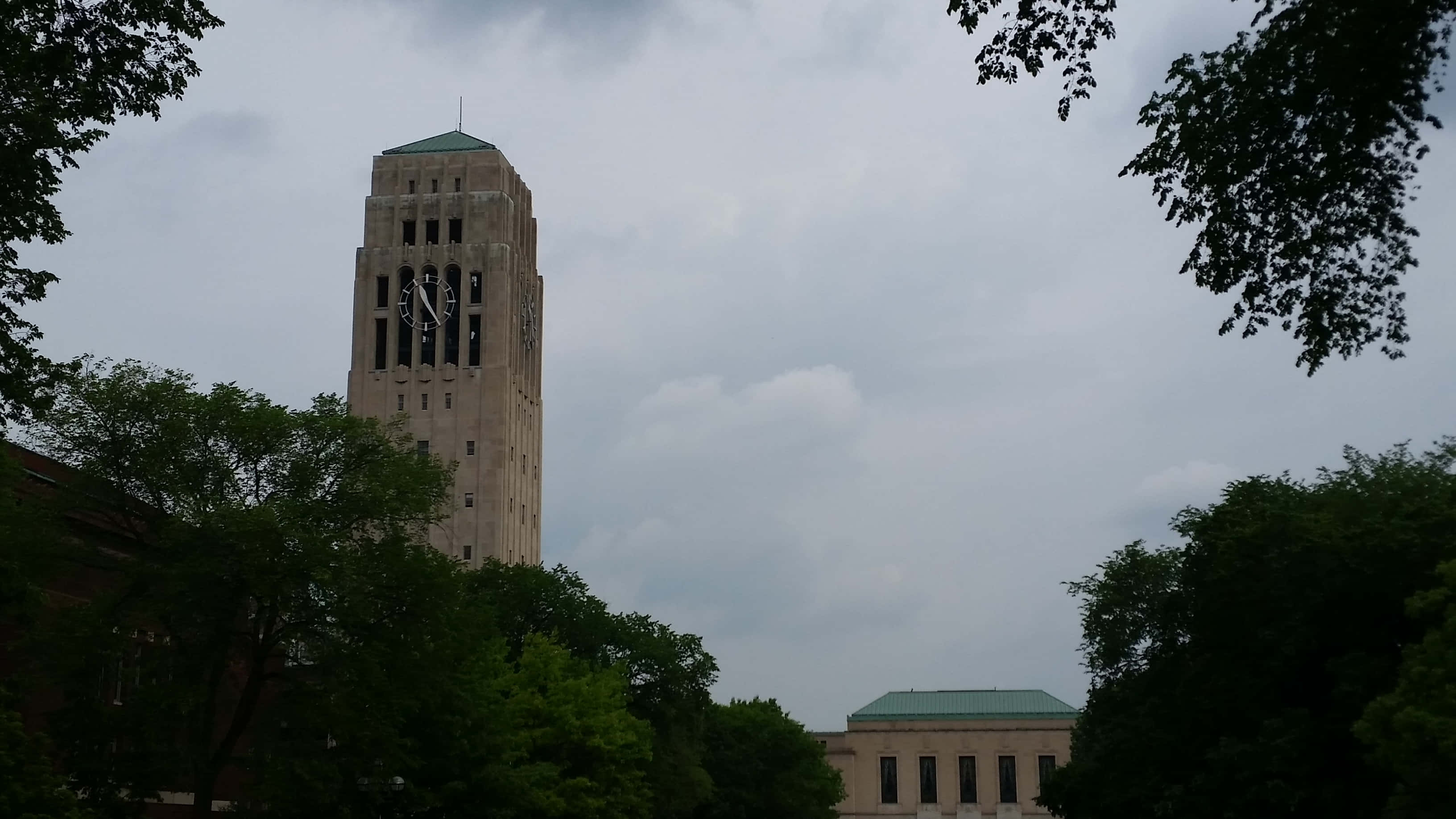 Ivory Tower, stone clock tower, canopy of green trees, 2K Desktop Wallpaper