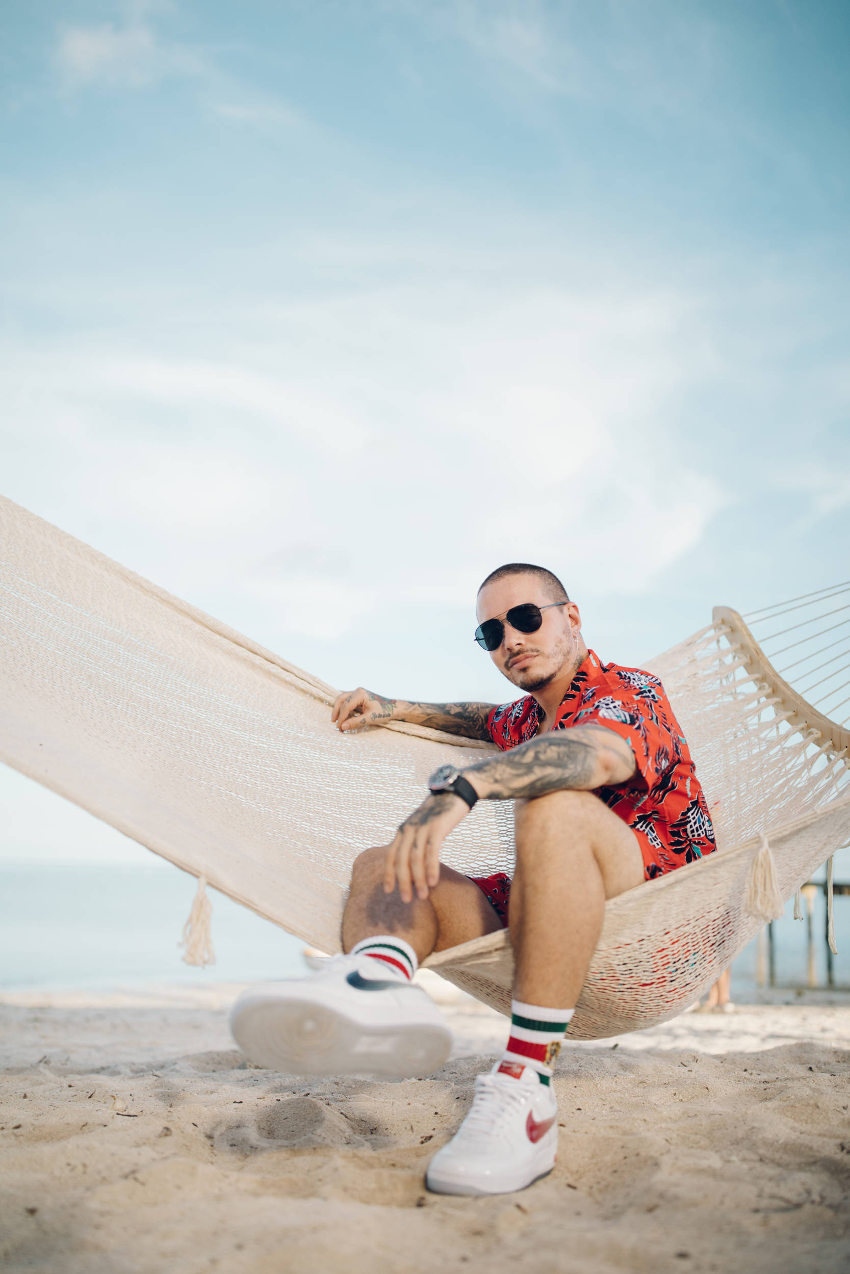 J Balvin, red floral shirt, beige hammock, Full HD Phone Wallpaper