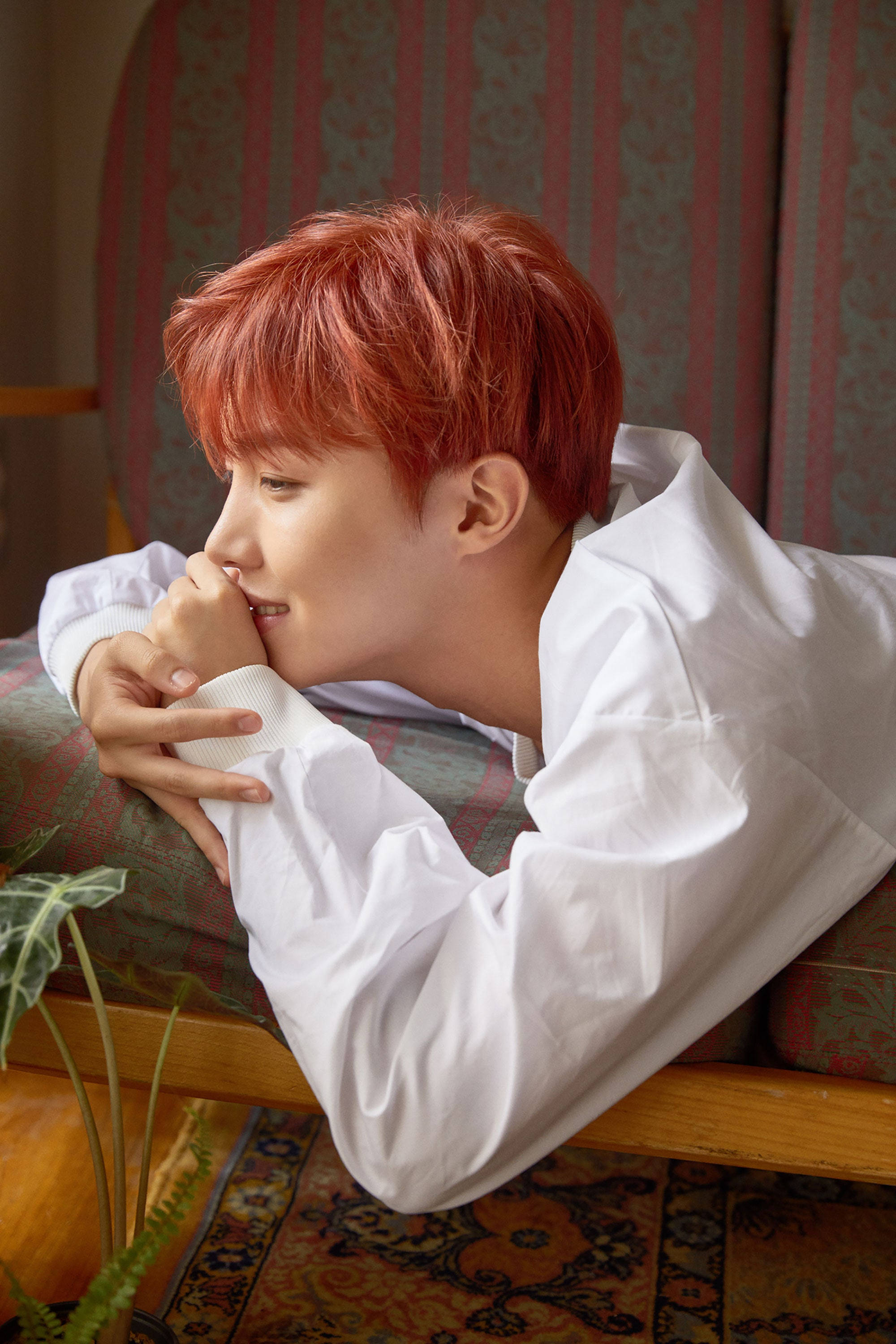J-hope, vibrant red hair, patterned sofa, 2K Phone Wallpaper
