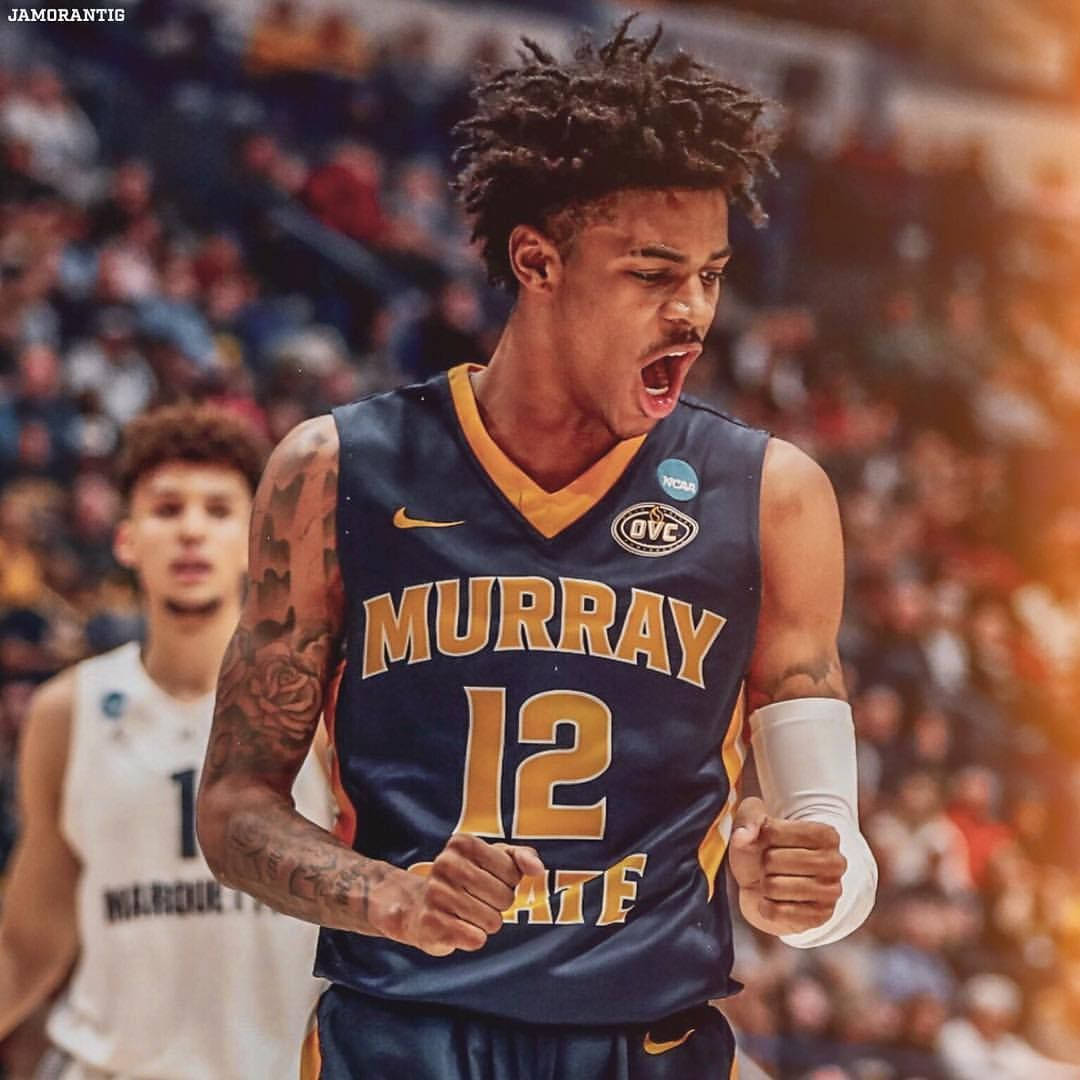 Ja Morant, blue and gold Murray State jersey, roars with fists clenched, SD Desktop Wallpaper