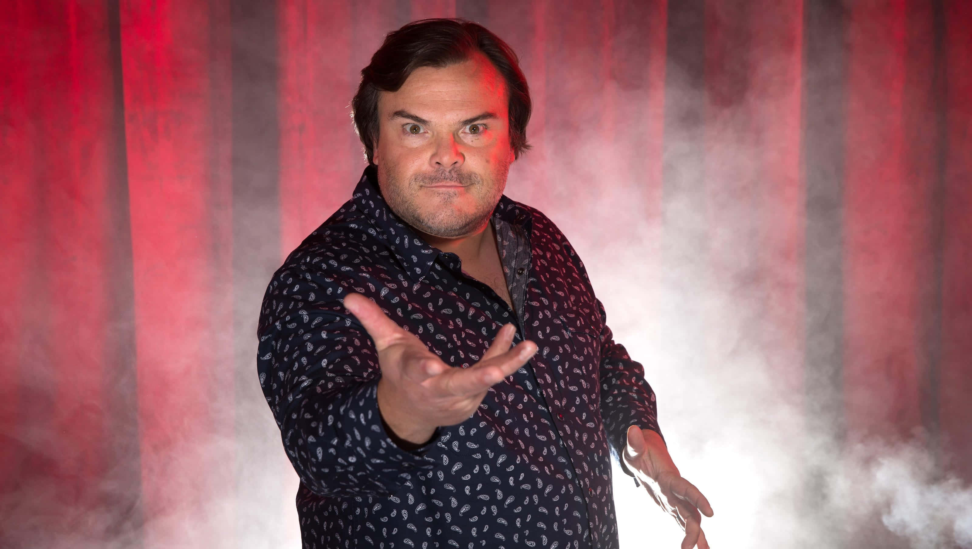 jack black, red curtains, theatrical smoke, 2K Desktop Wallpaper