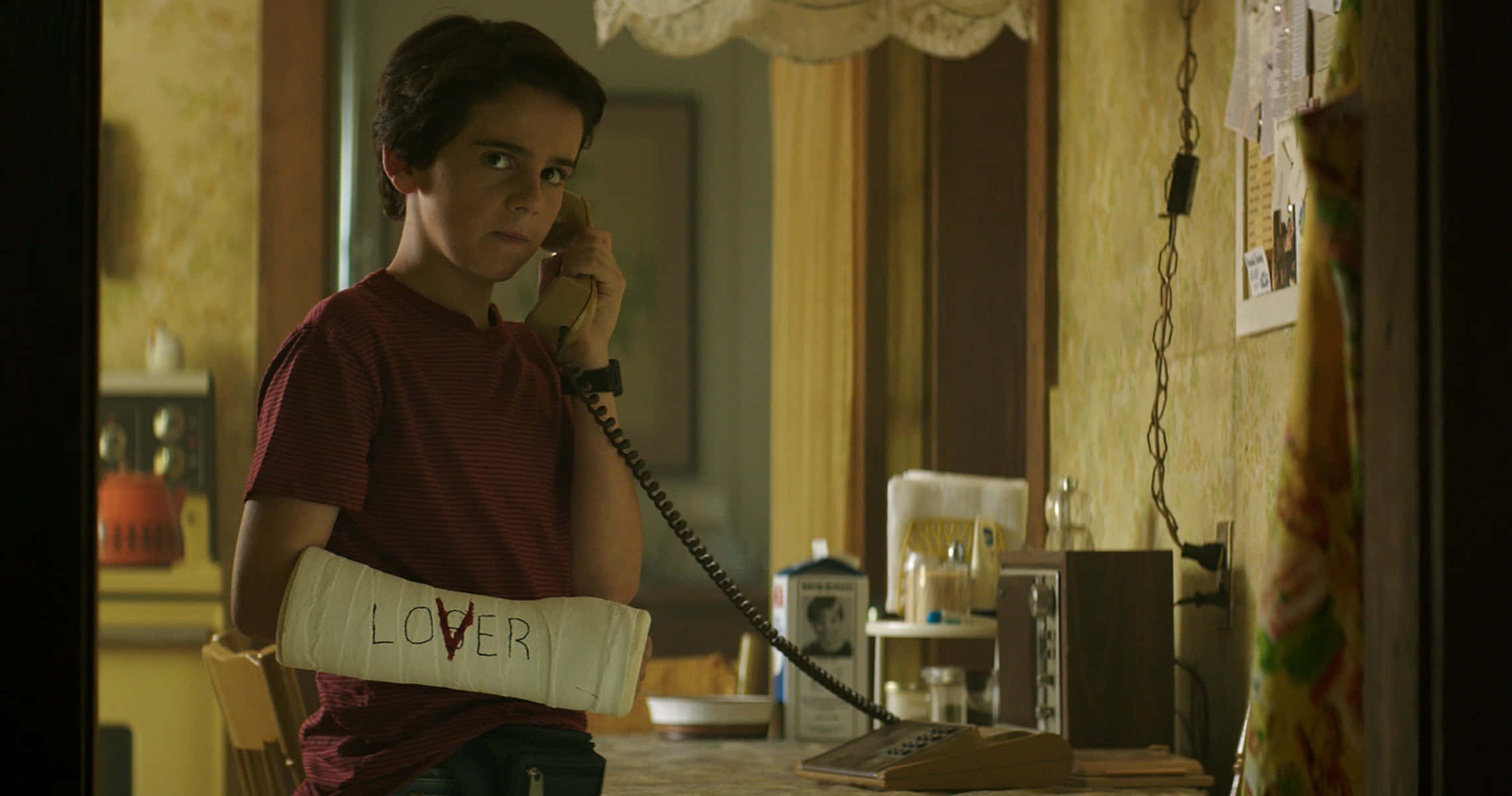 Jack Dylan Grazer, cast on his arm, vintage phone, Full HD Desktop Wallpaper