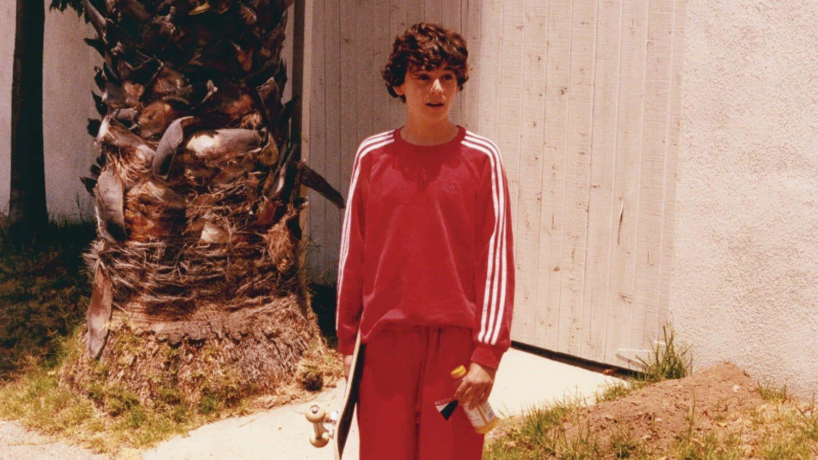 Jack Dylan Grazer, red tracksuit, weathered palm tree, HD Desktop Wallpaper