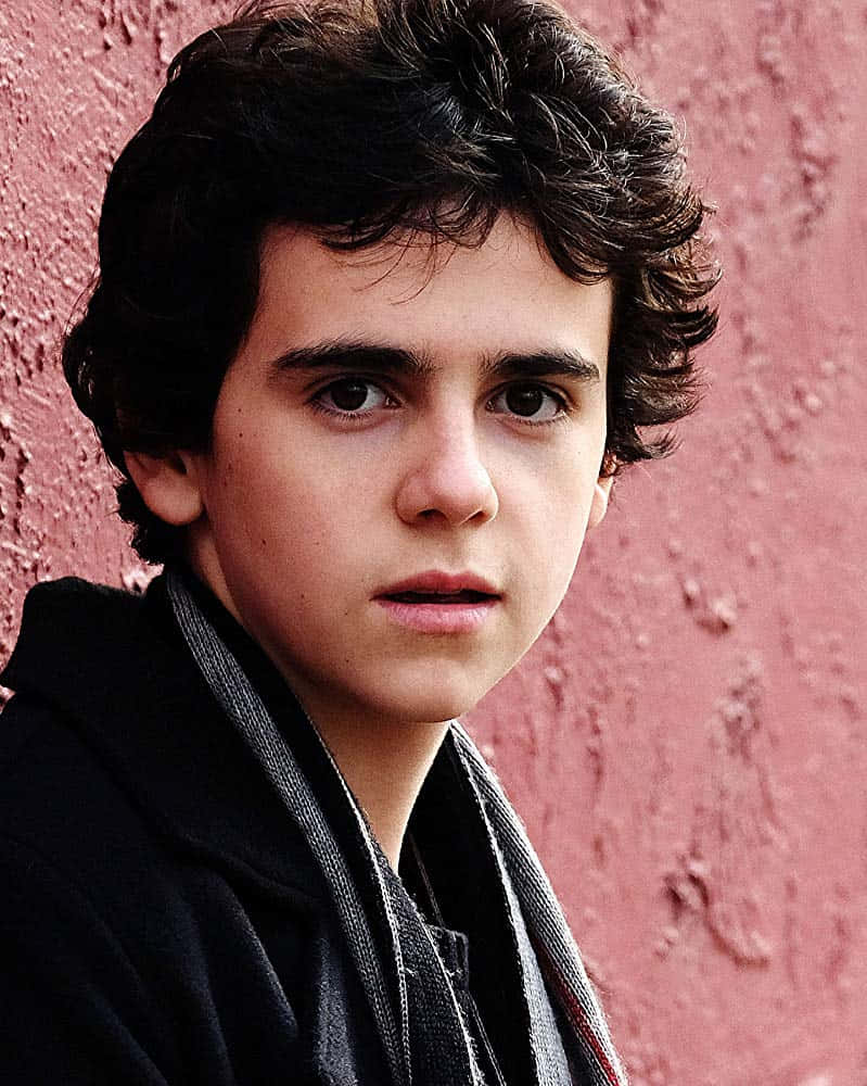 Jack Dylan Grazer, dark curly hair, textured pink wall, SD Phone Wallpaper