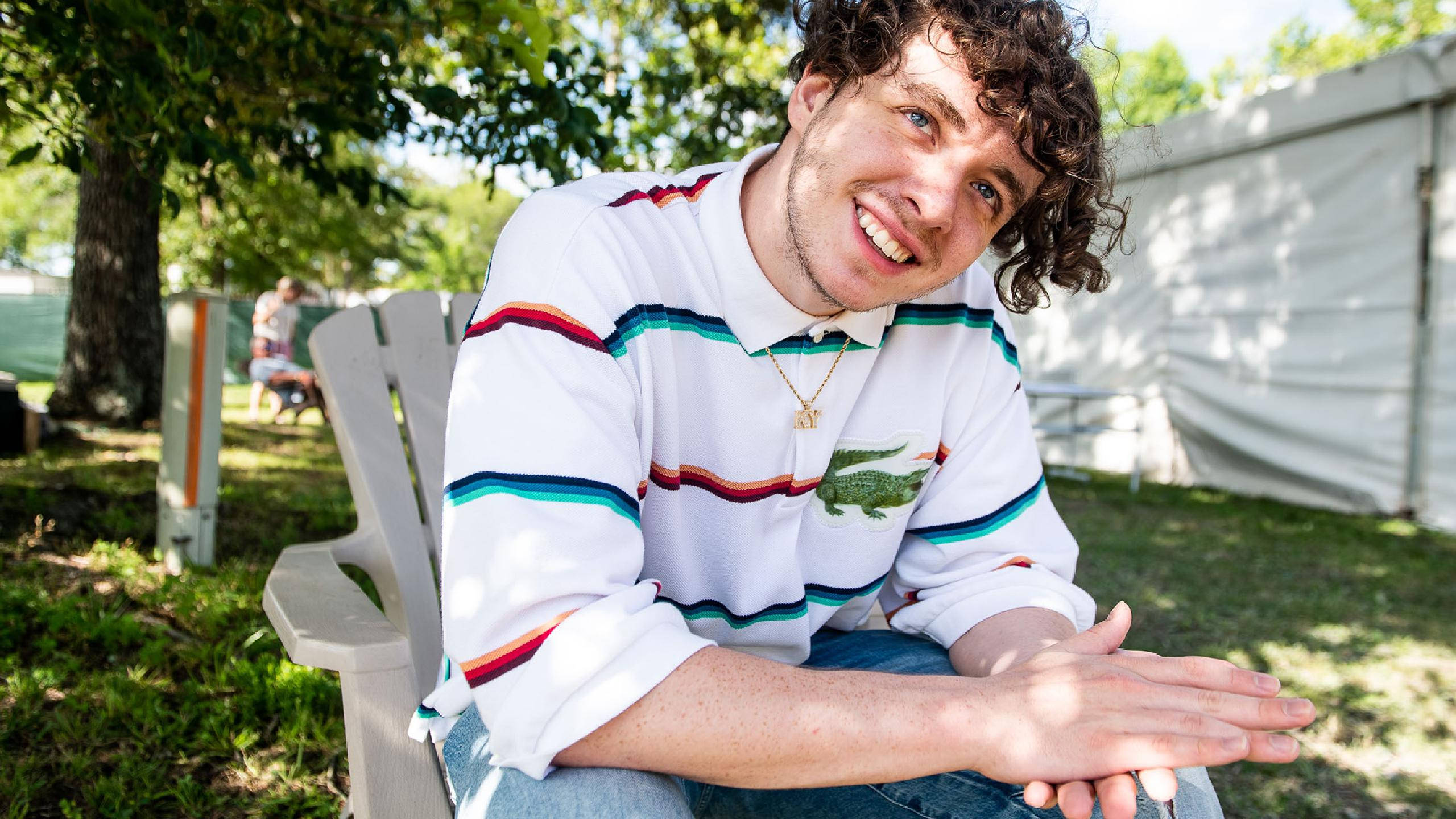 Jack Harlow, curly hair, white plastic chair, 2K Desktop Wallpaper