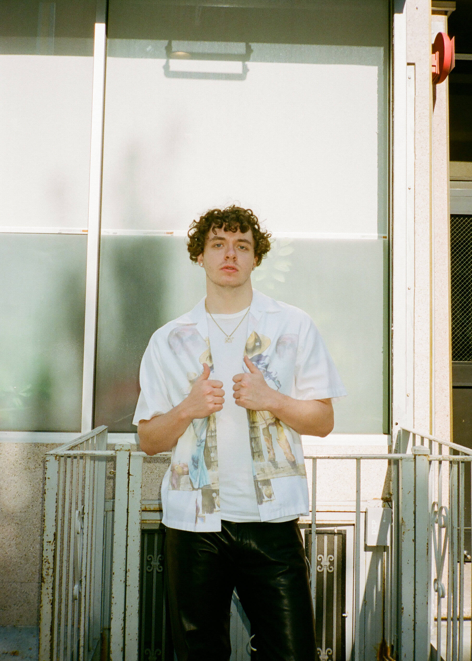 Jack Harlow, sunlit balcony, curly hair, 2K Phone Wallpaper