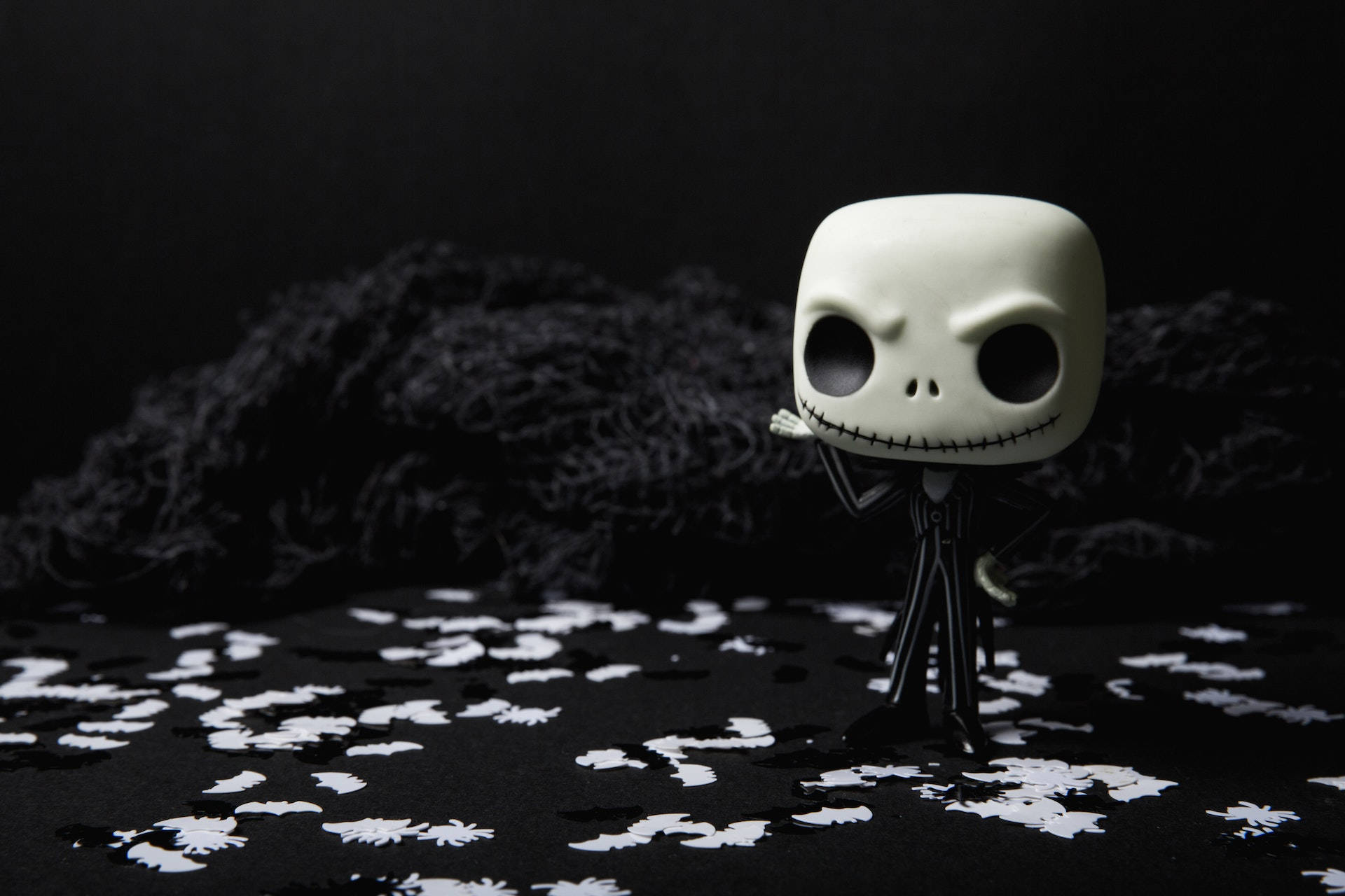 Jack Skellington, white skull-faced figurine, black surface, Full HD Desktop Wallpaper
