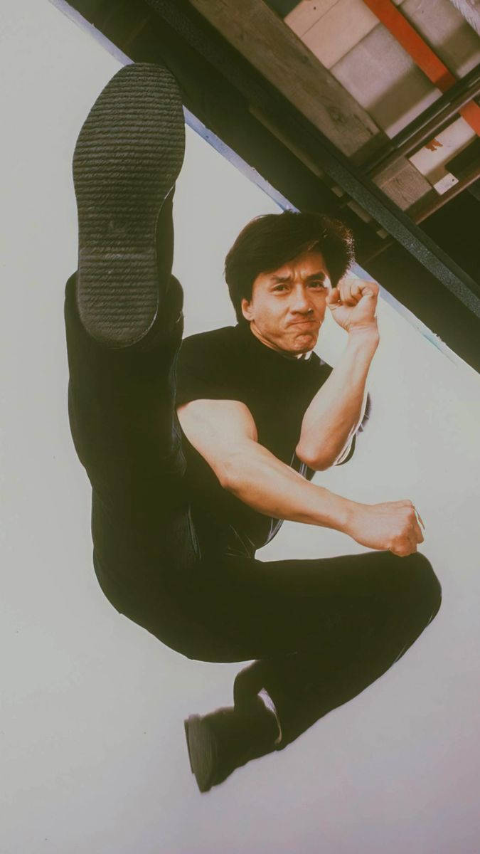 Jackie Chan, flying kick, black athletic wear, SD Phone Wallpaper