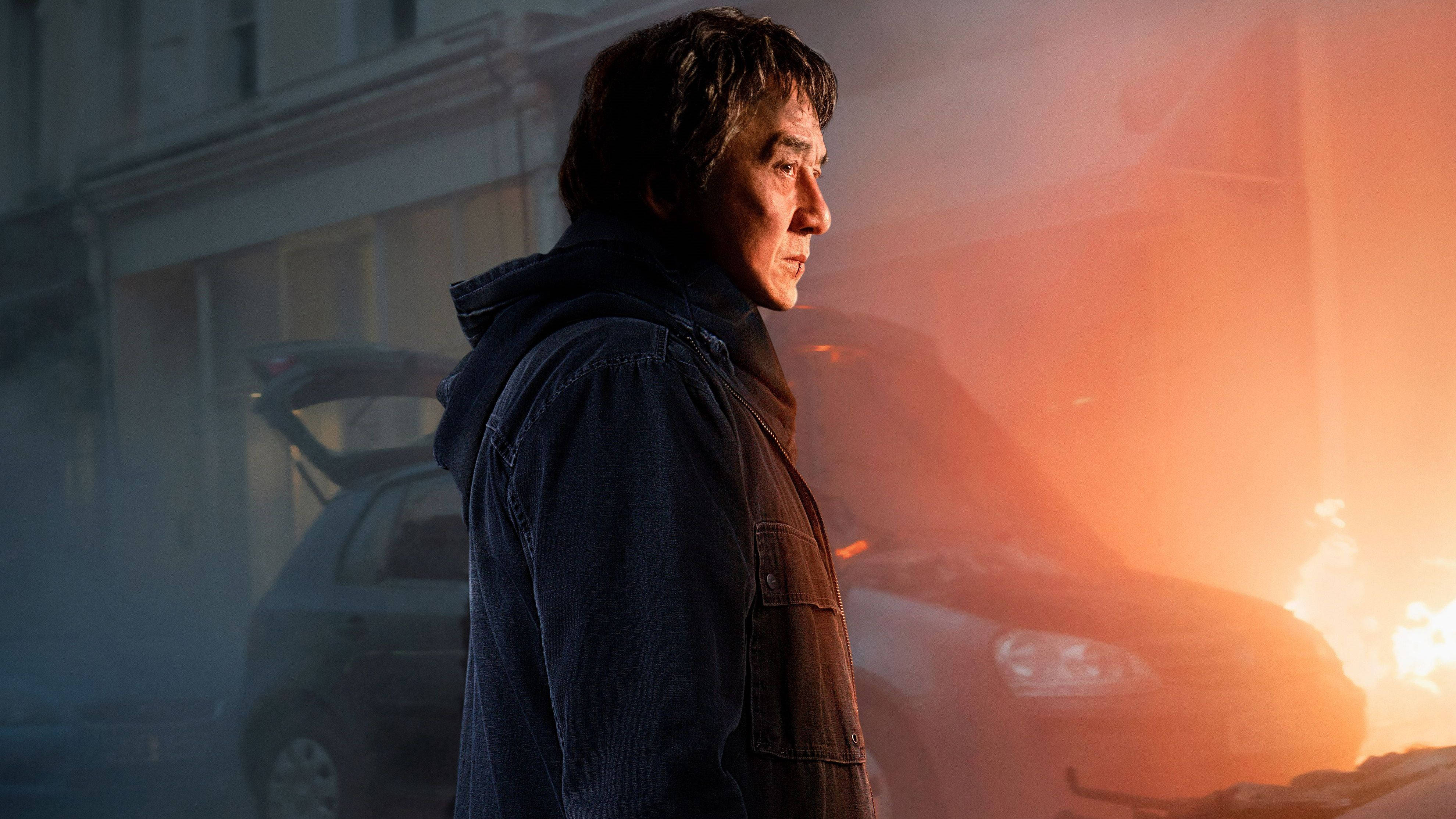 Jackie Chan, dark jacket, fiery burning car, 4K Desktop Wallpaper