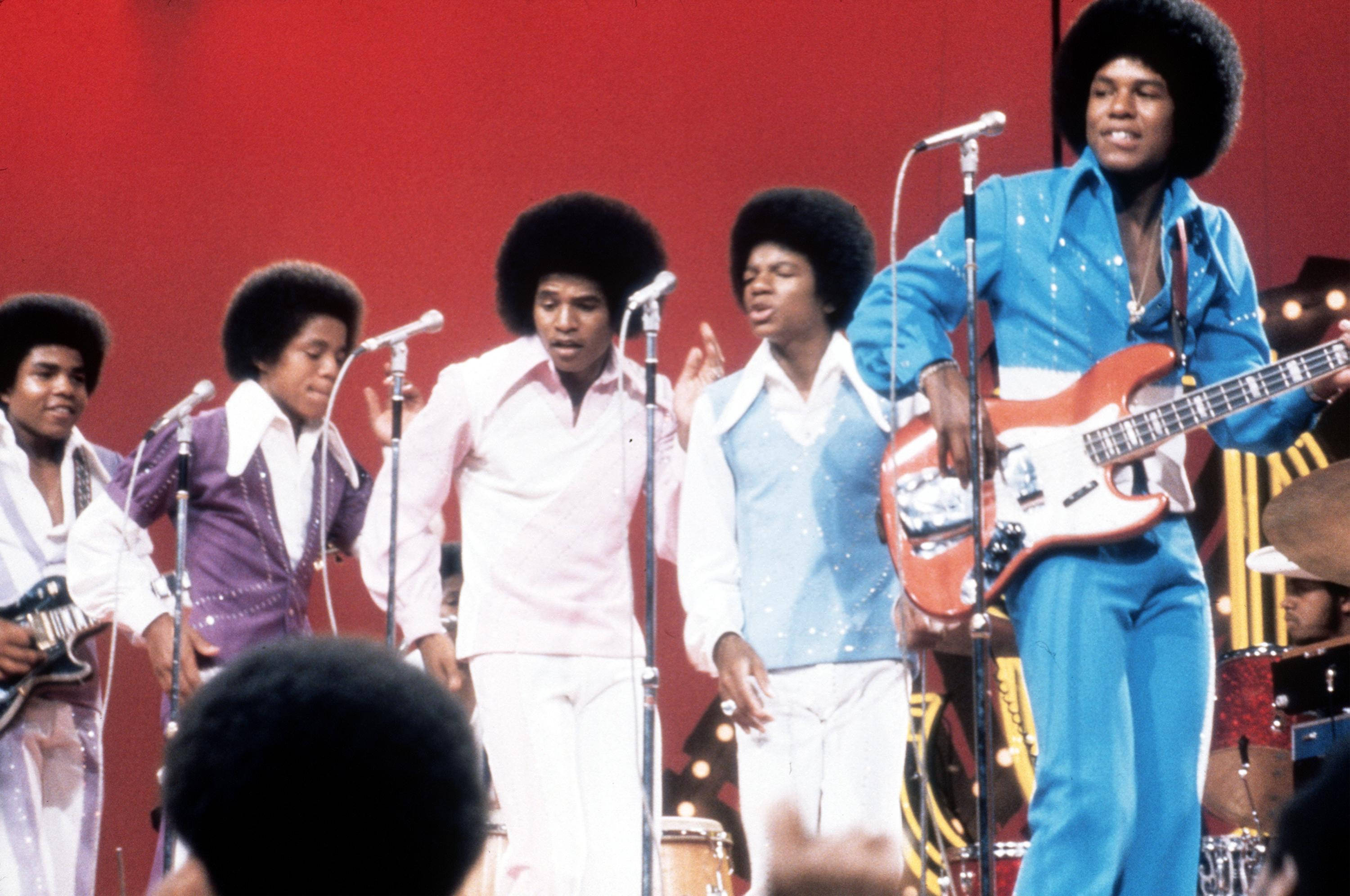 Jackson 5, 70s outfits, bold red backdrop, 2K Desktop Wallpaper