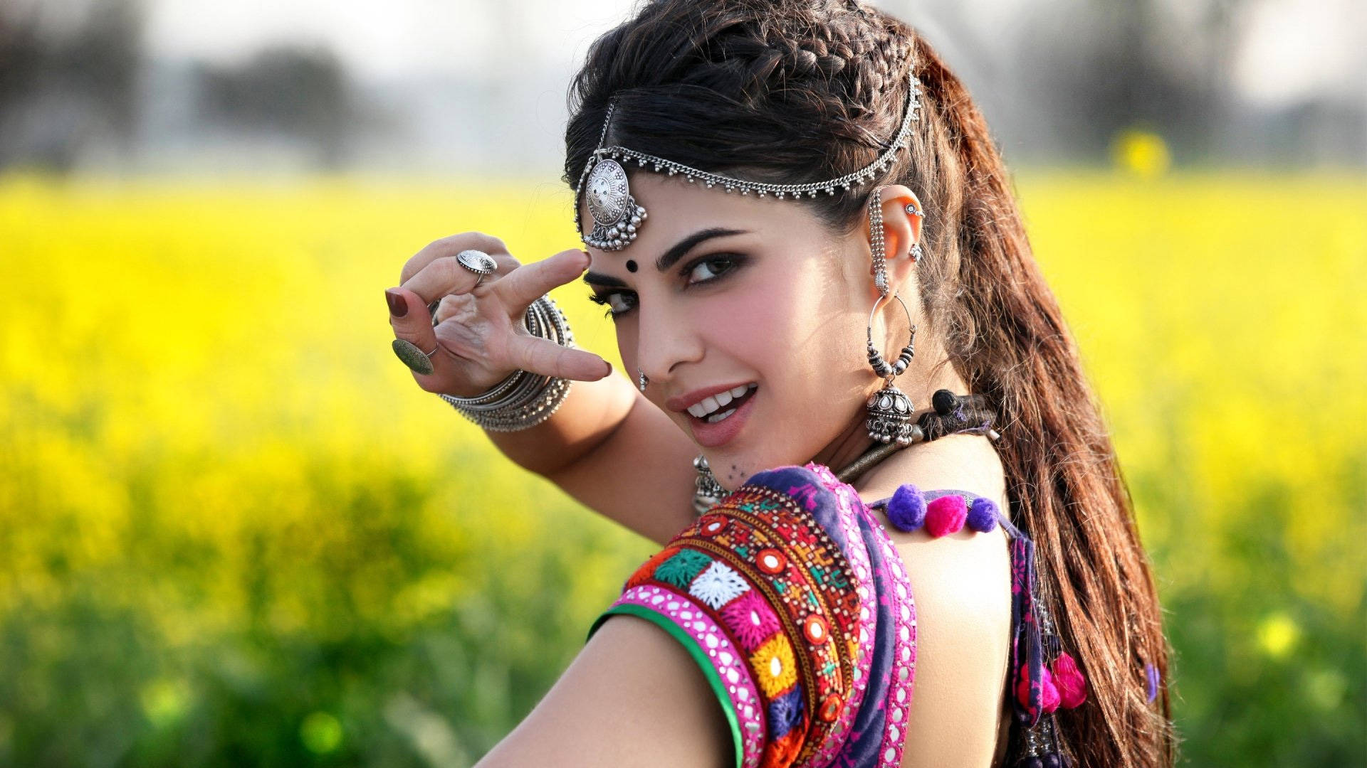 Jacqueline Fernandez, colorful traditional attire, vibrant yellow flower field, Full HD Desktop Wallpaper