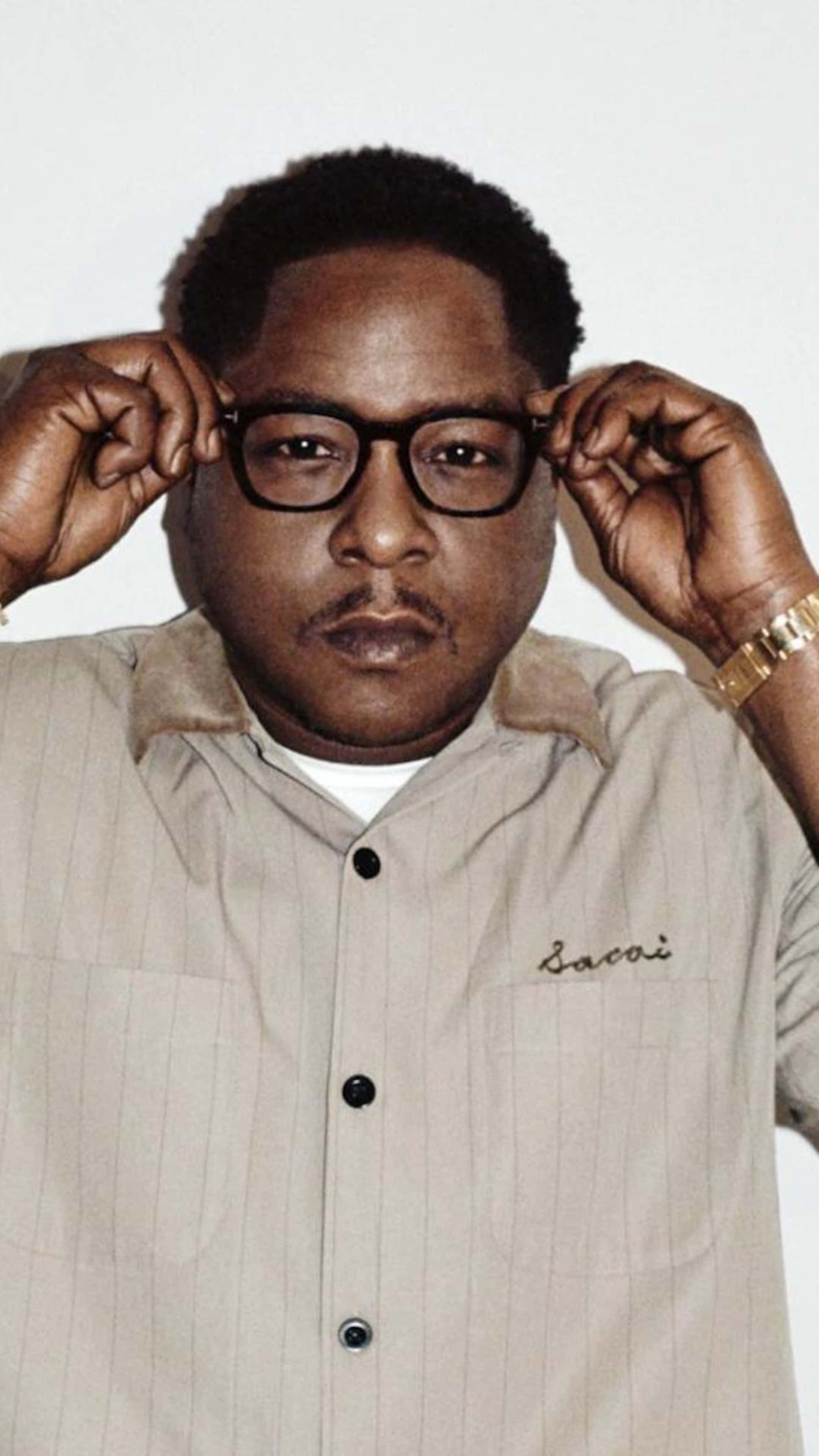 Jadakiss, thick black-rimmed glasses, beige pinstripe Saccoi shirt, 4K Phone Wallpaper