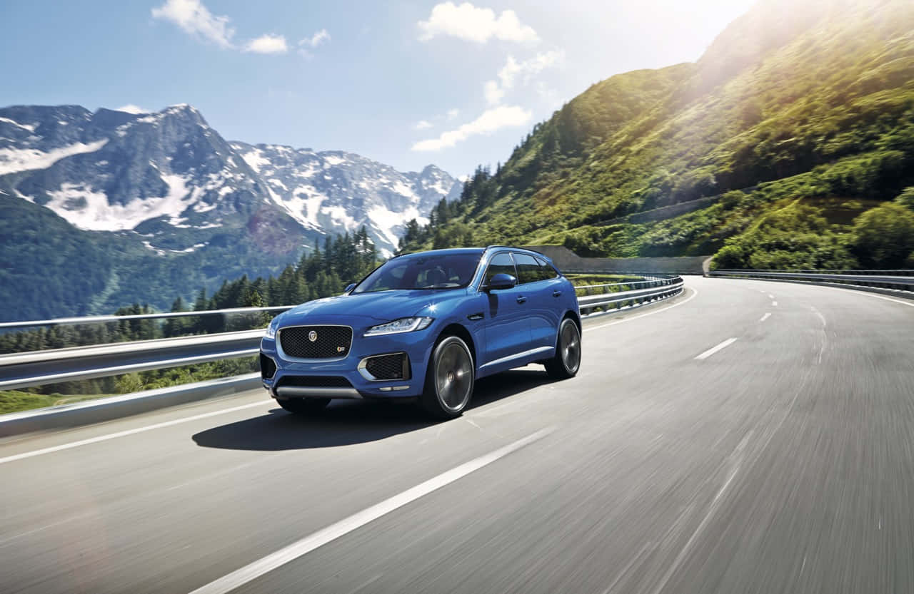 Jaguar F-Pace, sleek blue, winding mountain road, HD Desktop Wallpaper