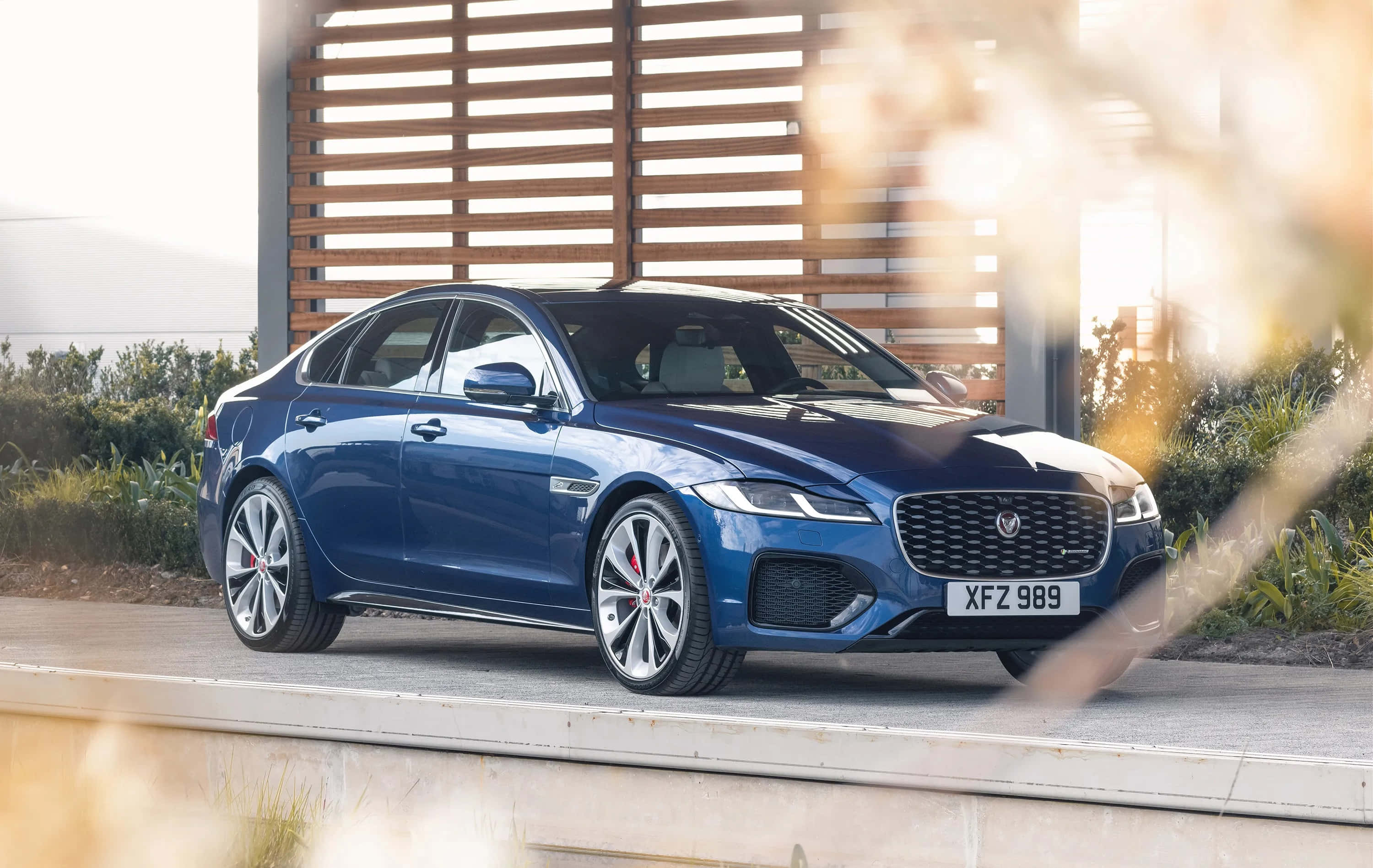 Jaguar XF, blue, modern concrete driveway, 2K Desktop Wallpaper
