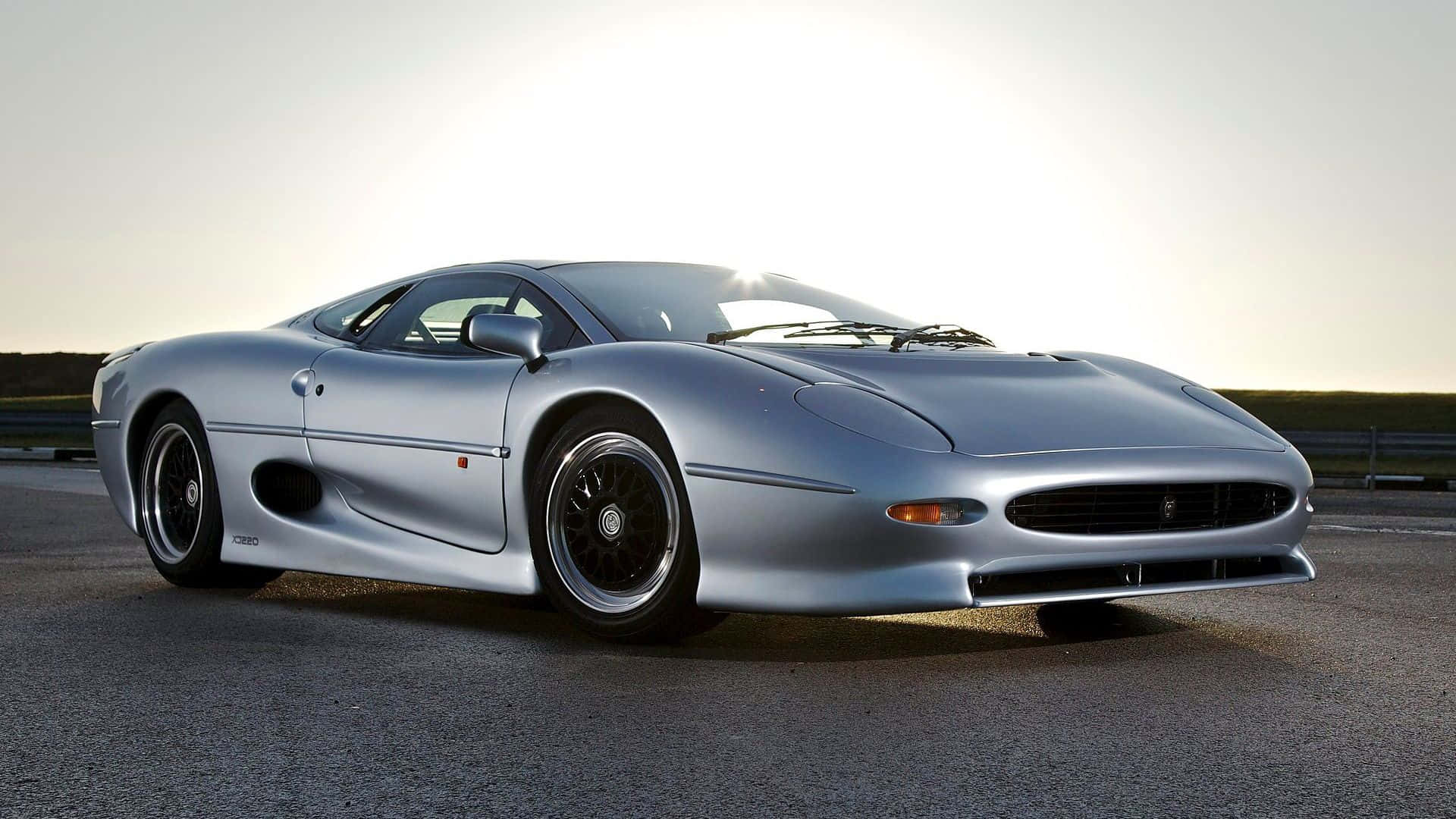Jaguar XJ220, sleek silver, golden sunset, Full HD Desktop Wallpaper