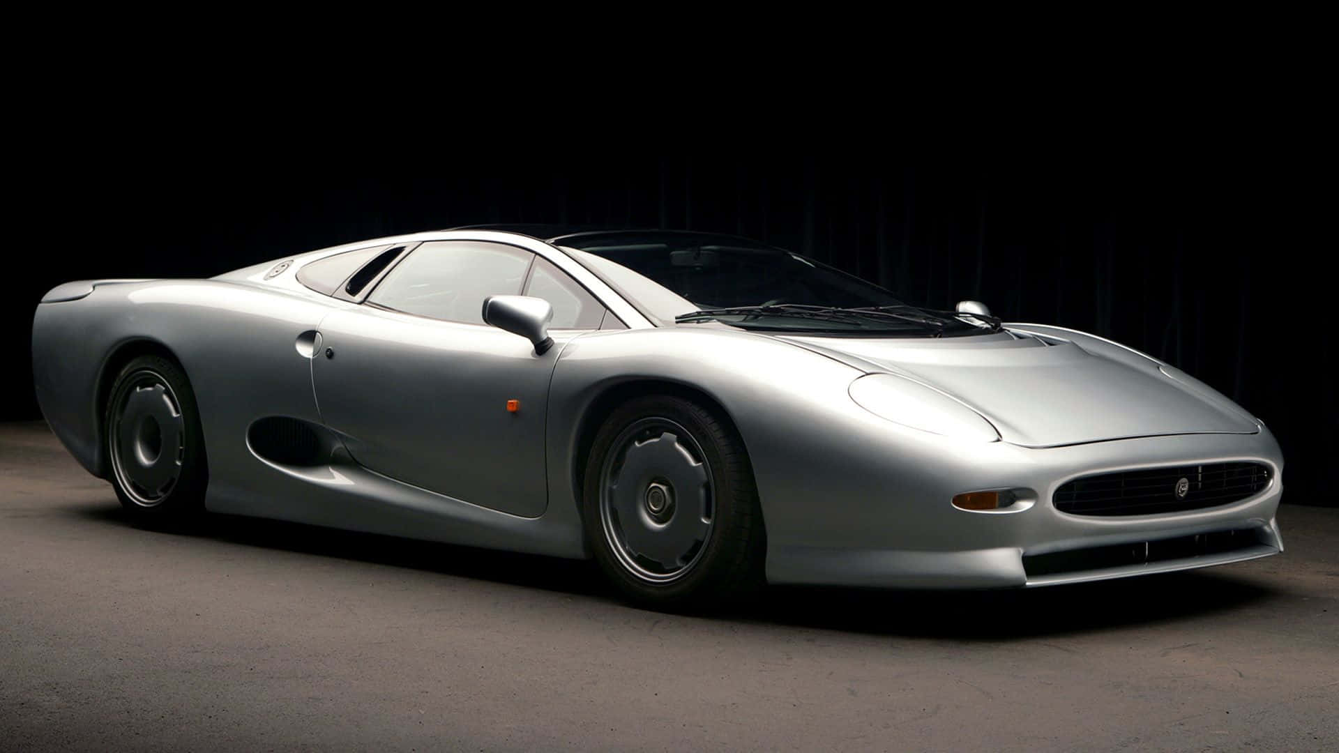 Jaguar XJ220, sleek silver, studio lights, Full HD Desktop Wallpaper