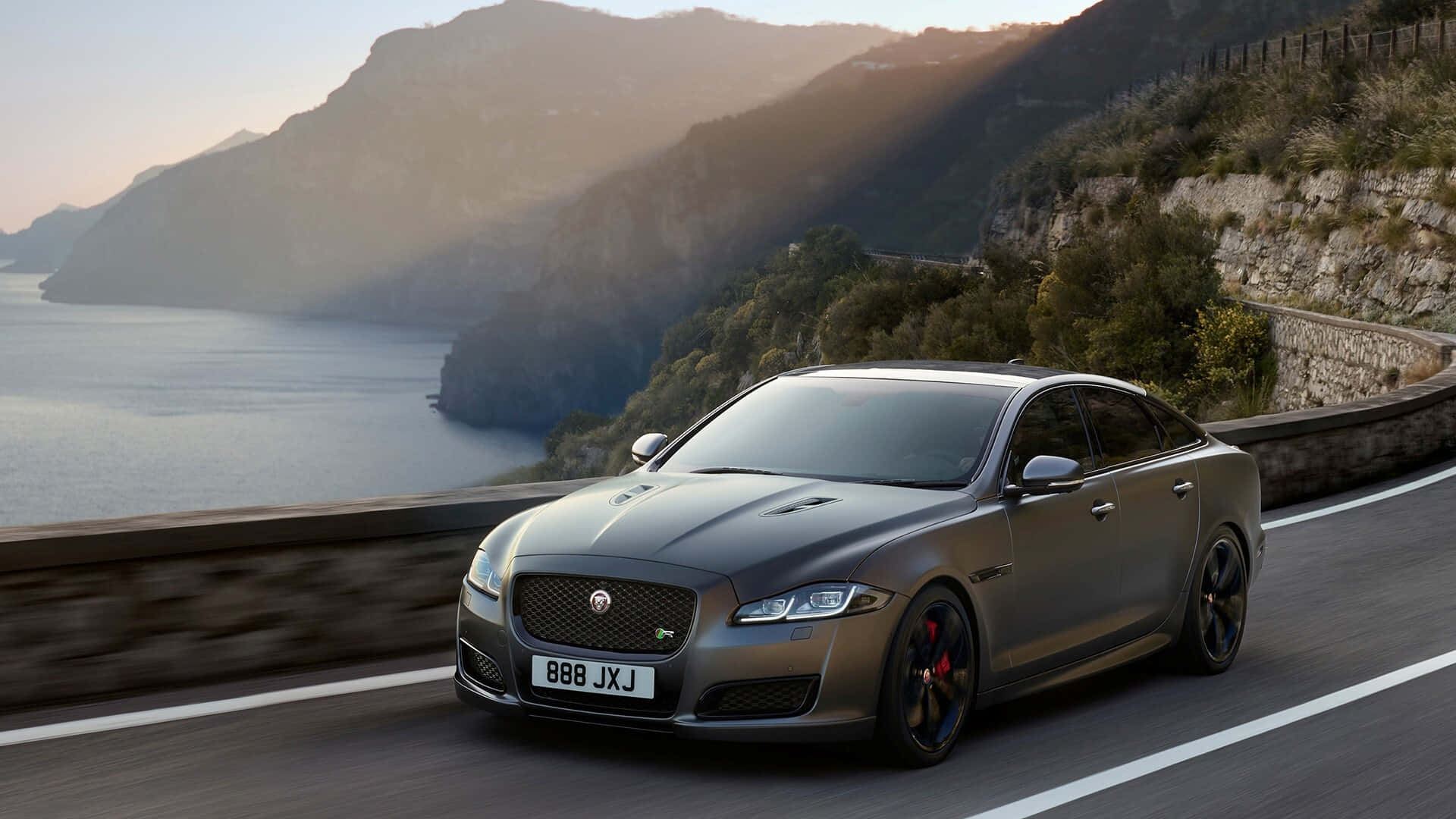 Jaguar XJR, matte gray, coastal mountain road, Full HD Desktop Wallpaper