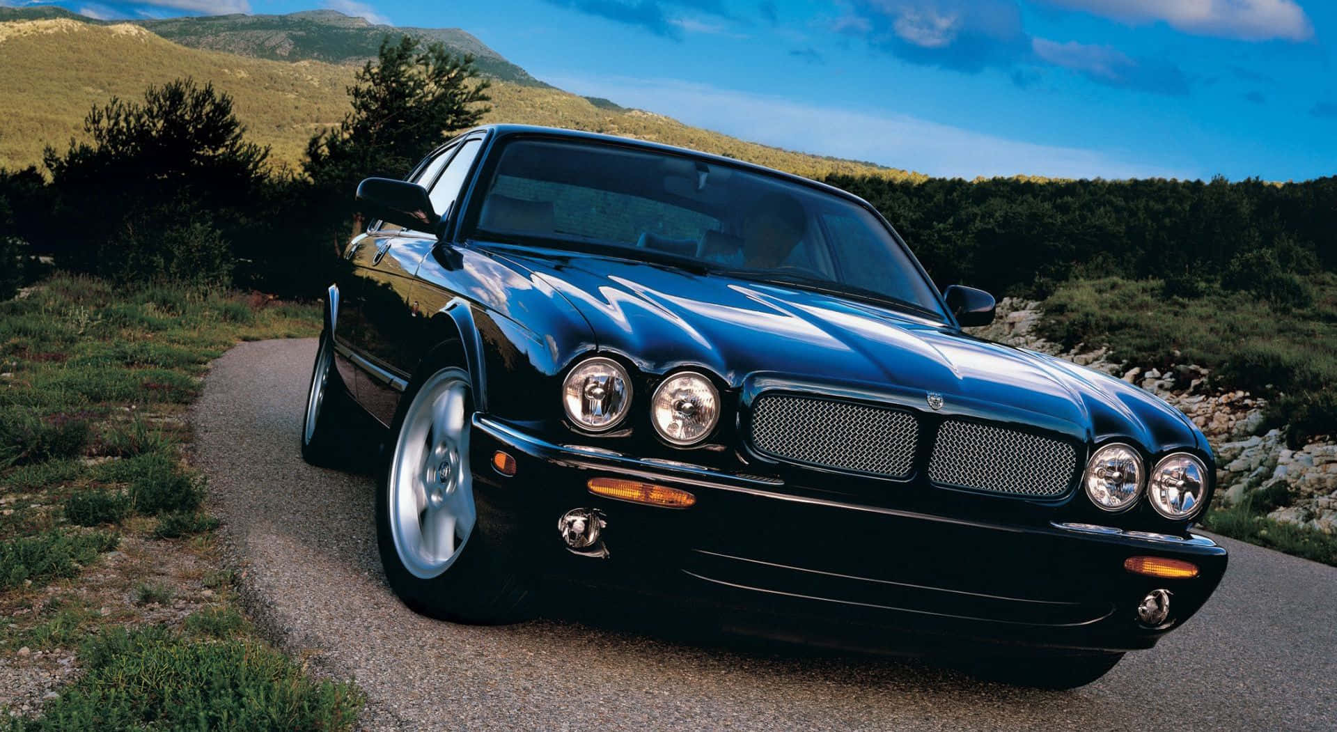 Jaguar XJR, black, winding mountain road, Full HD Desktop Wallpaper