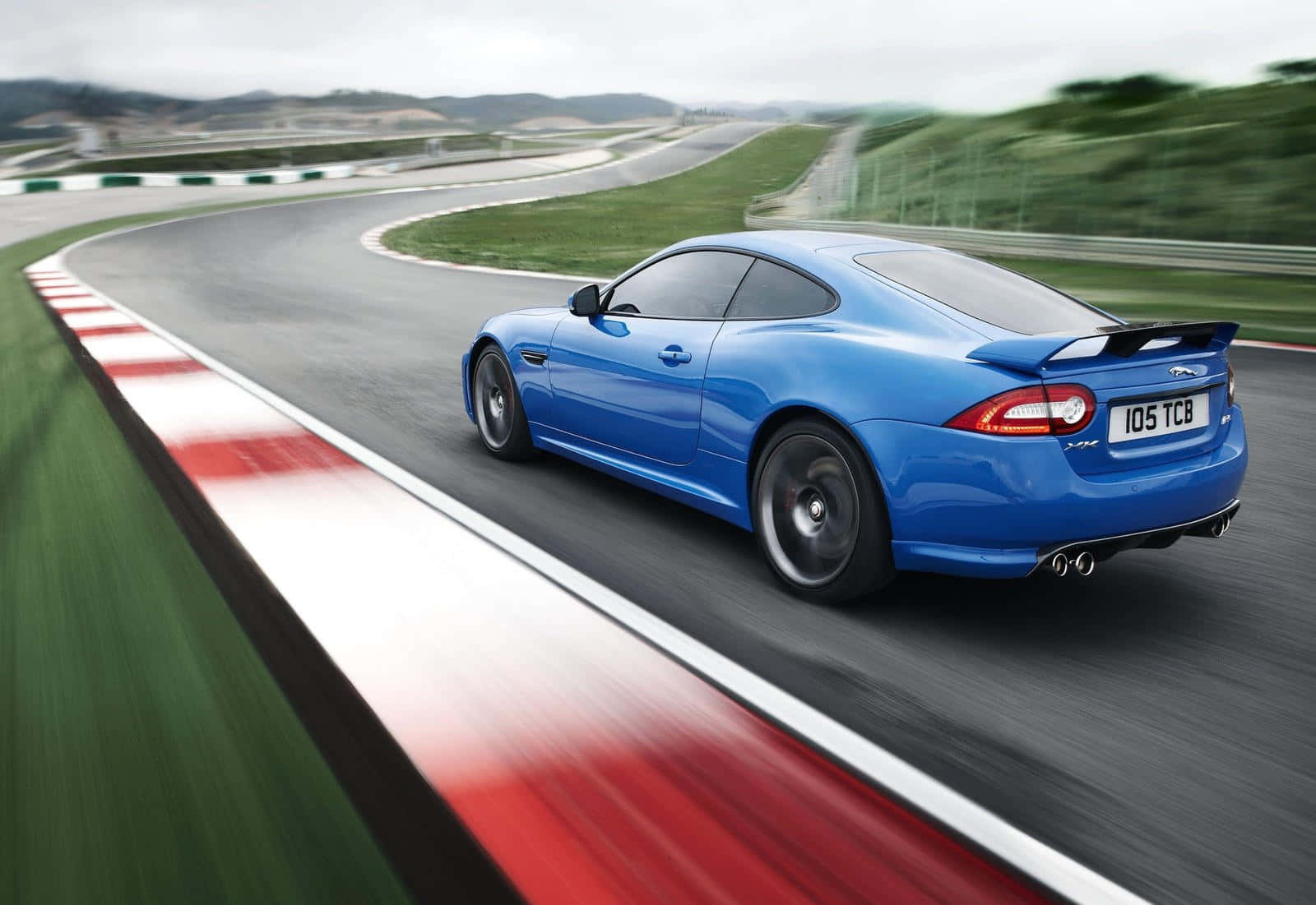 Jaguar XKR-S, racetrack curve, vibrant blue, HD Desktop Wallpaper