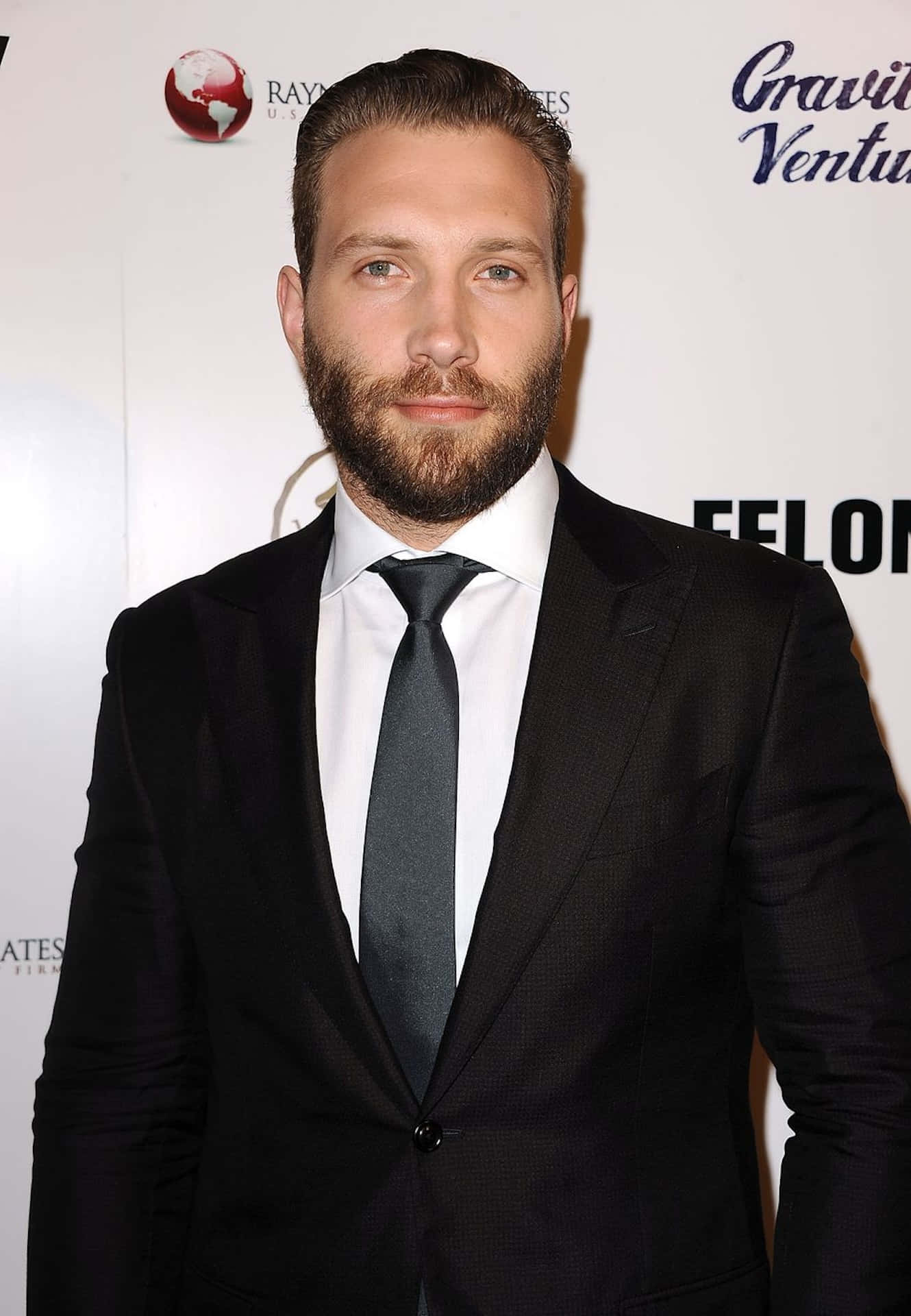 Jai Courtney, black suit, tie, Full HD Phone Wallpaper