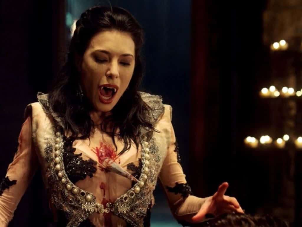 Jaime Murray, bloodstained ornate gown, candlelit room, SD Desktop Wallpaper