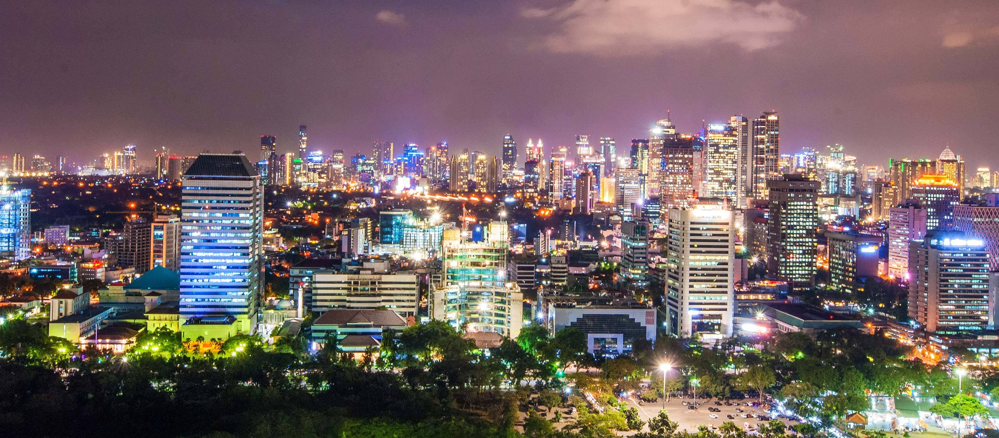 Jakarta, neon lights, towering skyscrapers, 2K Desktop Wallpaper