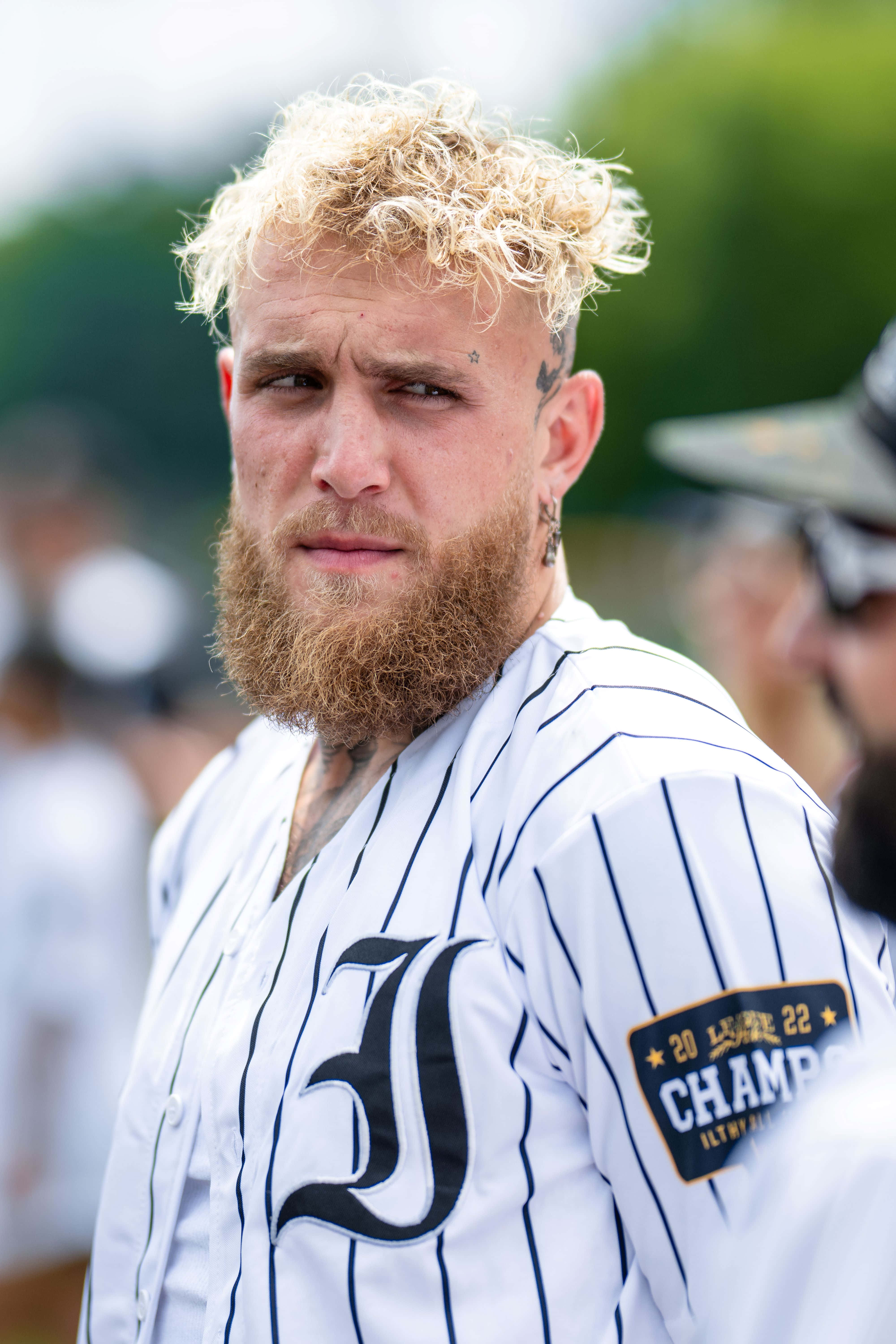 Jake Paul, white pinstripe jersey, large black 'J', 5K Phone Wallpaper