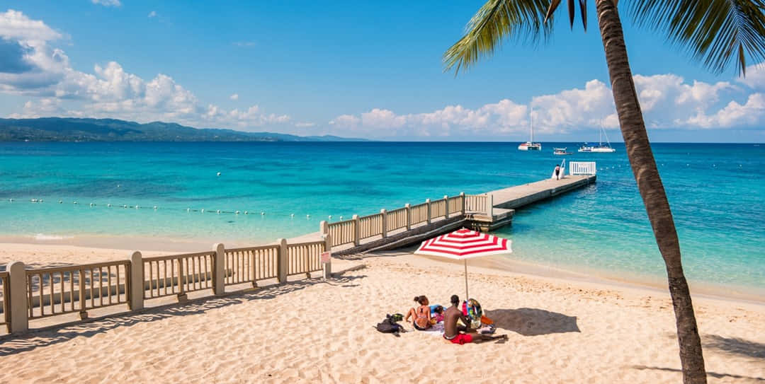 Jamaican Beach, red and white striped umbrella, turquoise water, SD Desktop Wallpaper