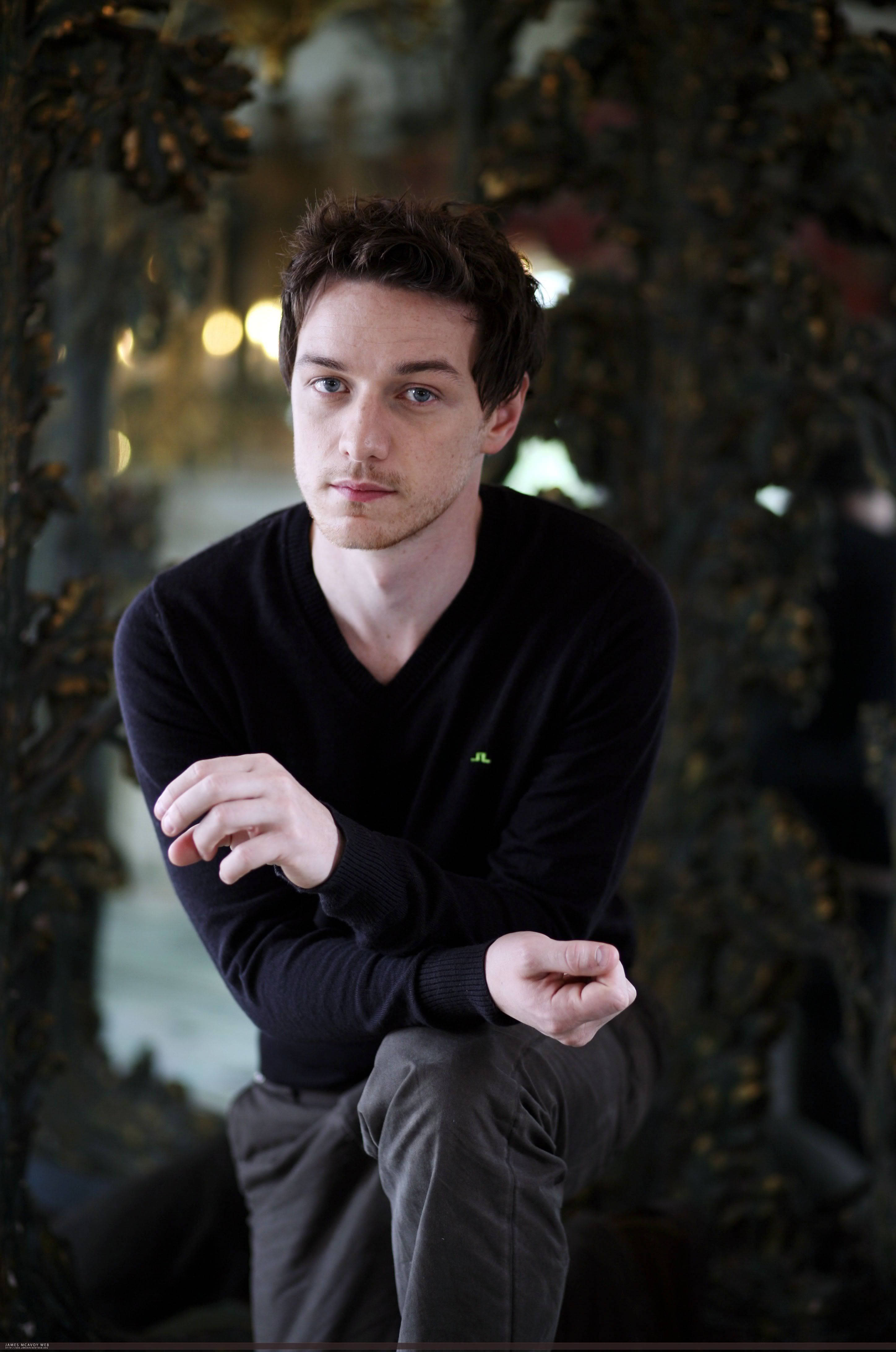 James McAvoy, black sweater, blurred foliage, 4K Phone Wallpaper