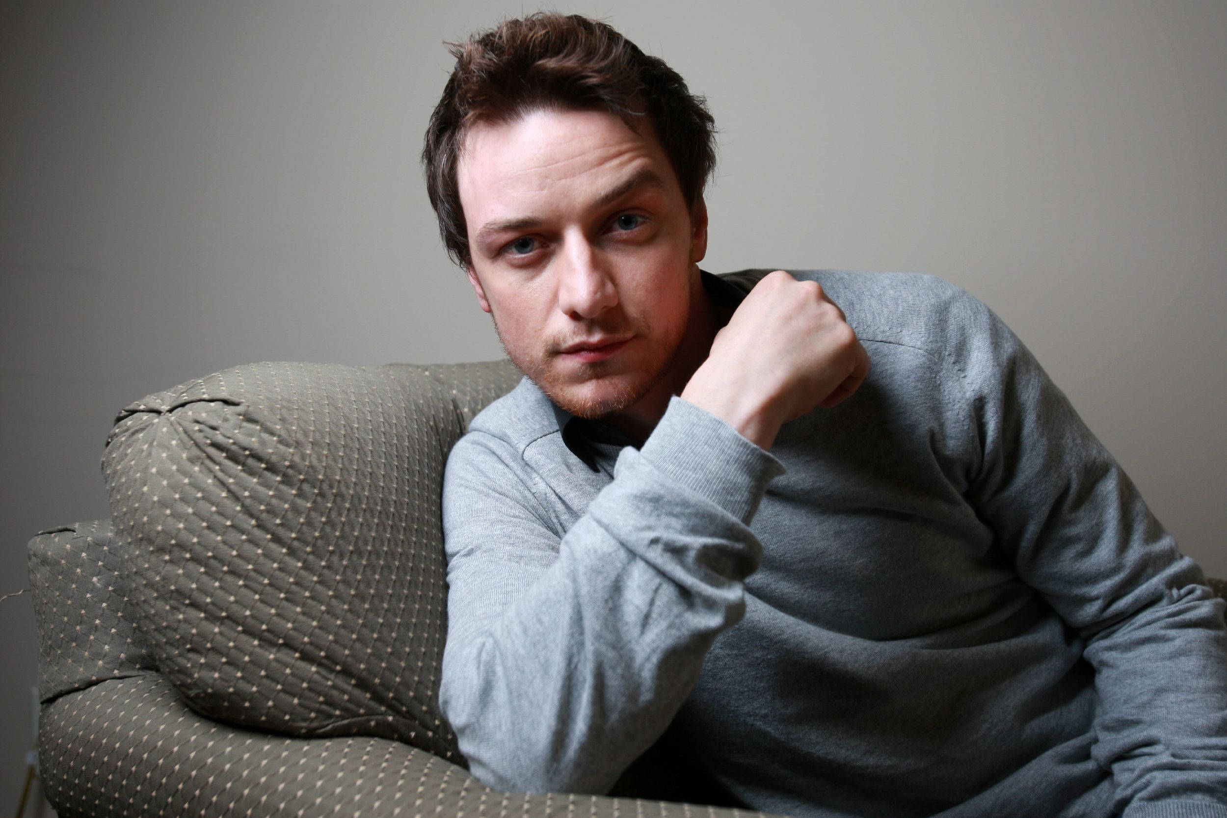 James McAvoy, gray sweater, patterned couch, Full HD Desktop Wallpaper