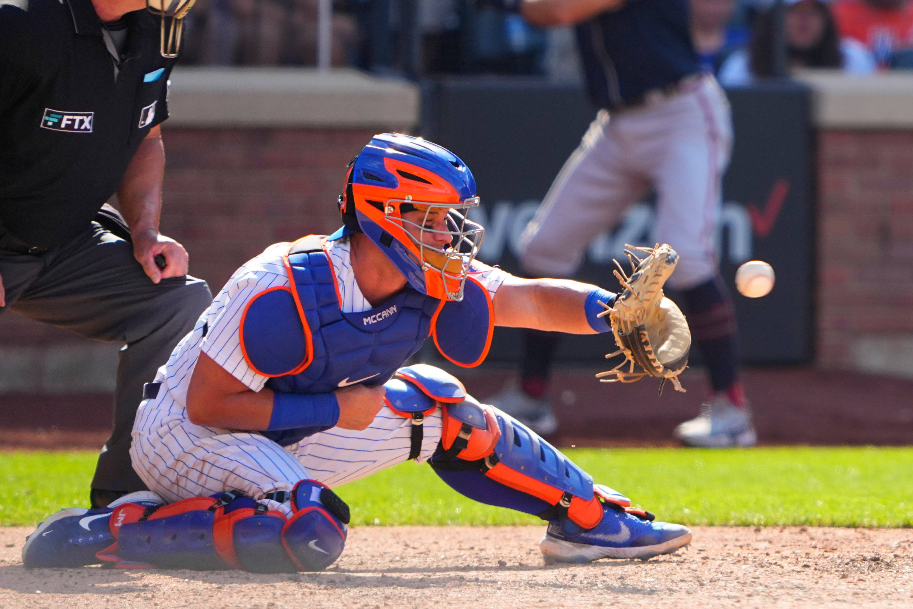 James McCann, blue and orange gear, sunlit field, 2K Desktop Wallpaper