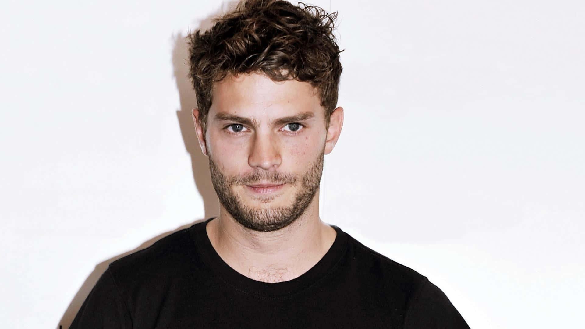 Jamie Dornan, classic black suit, tousled brown hair, Full HD Desktop Wallpaper