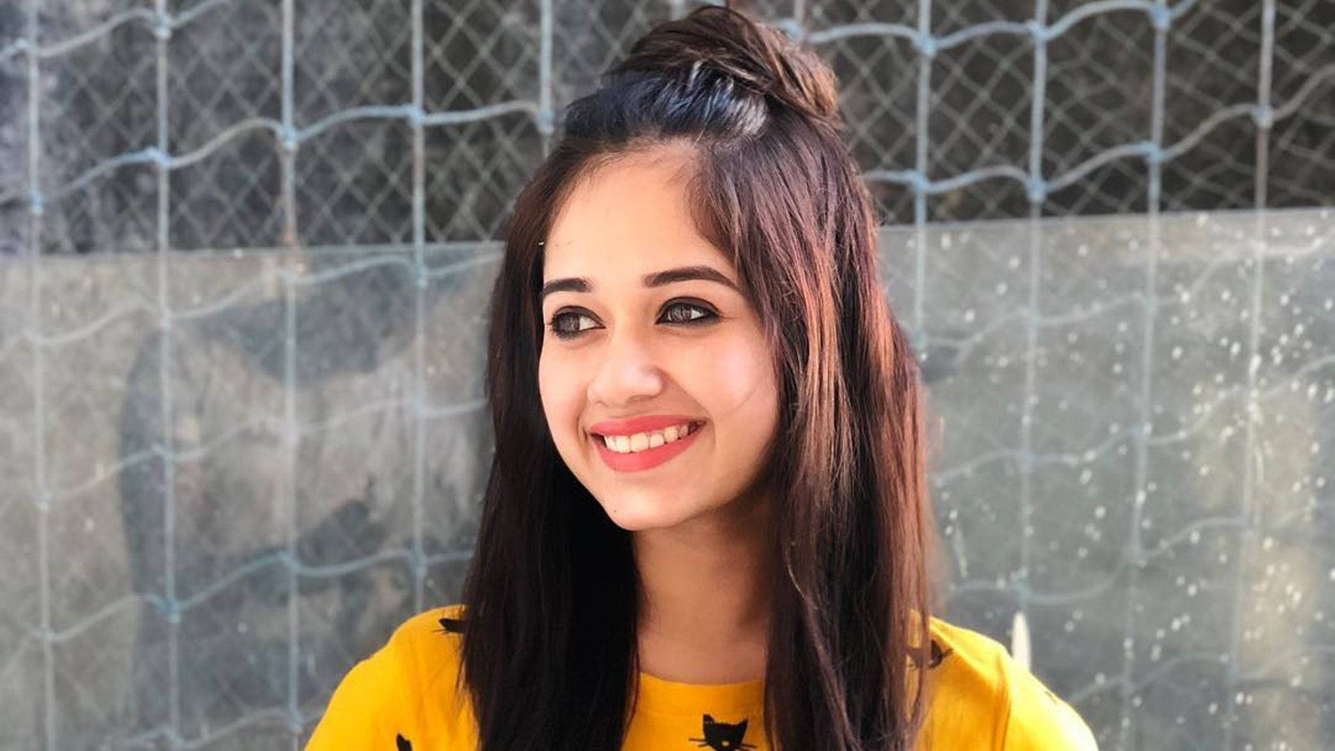 Jannat Zubair, bright yellow shirt, dark hair in a bun, Full HD Desktop Wallpaper
