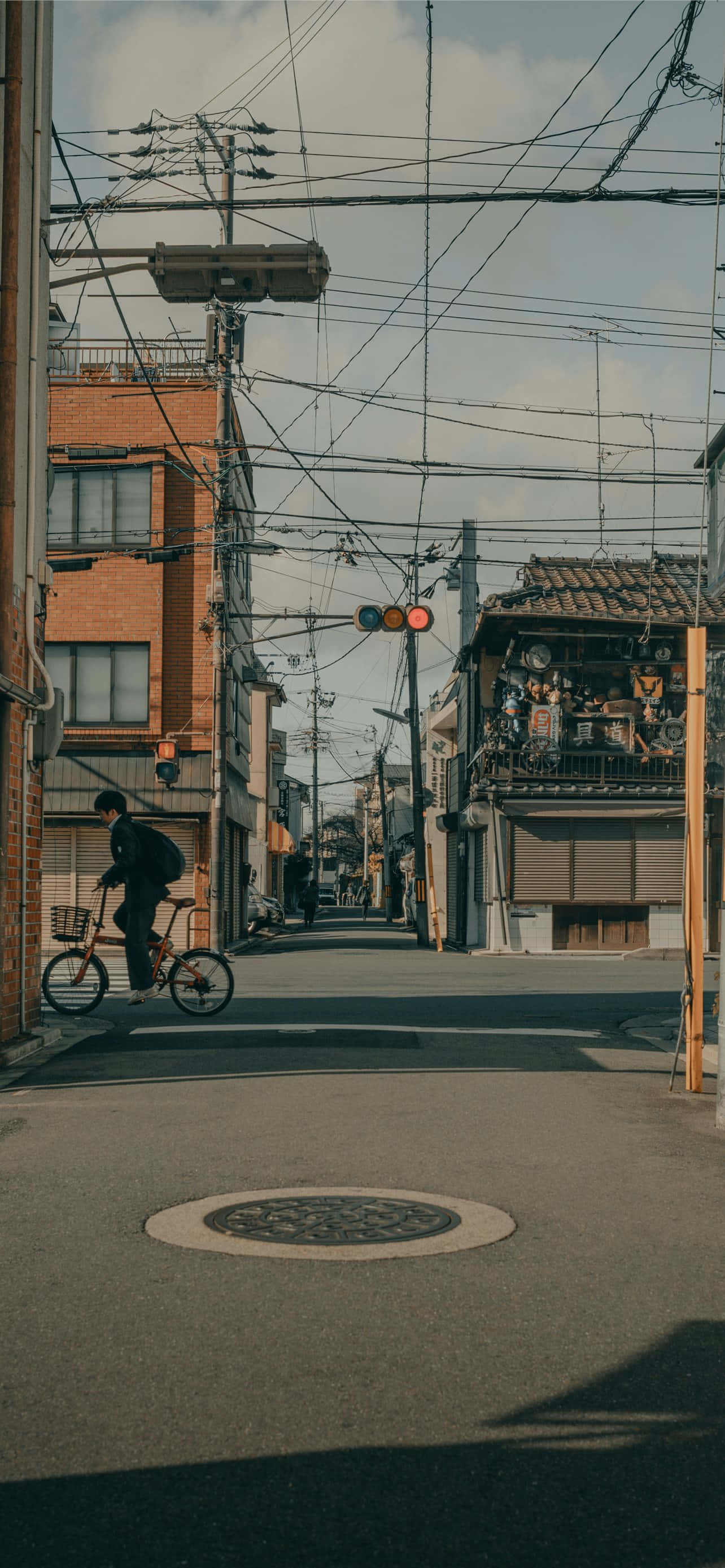 Japanese iPhone, narrow Japanese street, brick buildings, 2K Phone Wallpaper