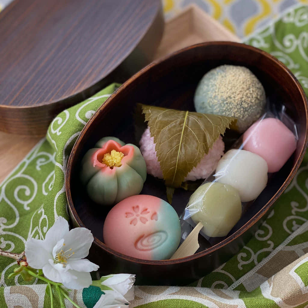 Japanese mochi desserts, cherry blossom accents, wooden bowl, SD Desktop Wallpaper