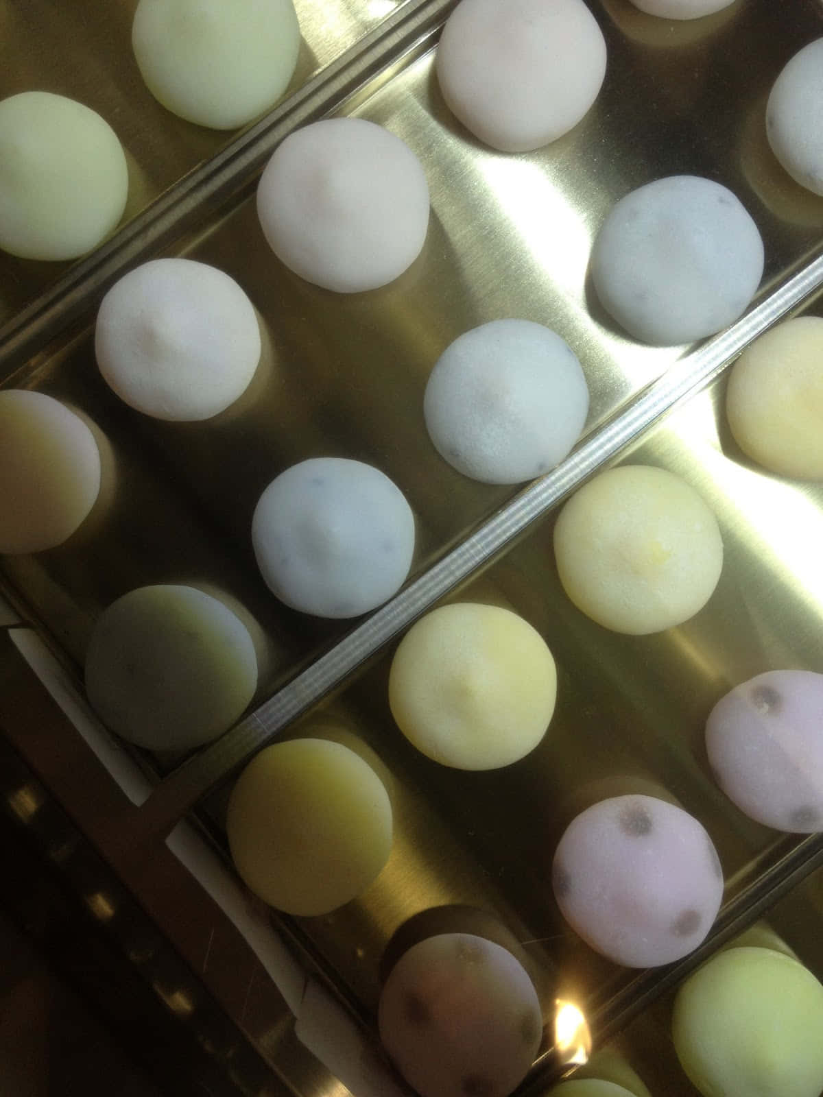 pastel-colored mochi balls, gleaming gold tray, warm lighting, HD Phone Wallpaper