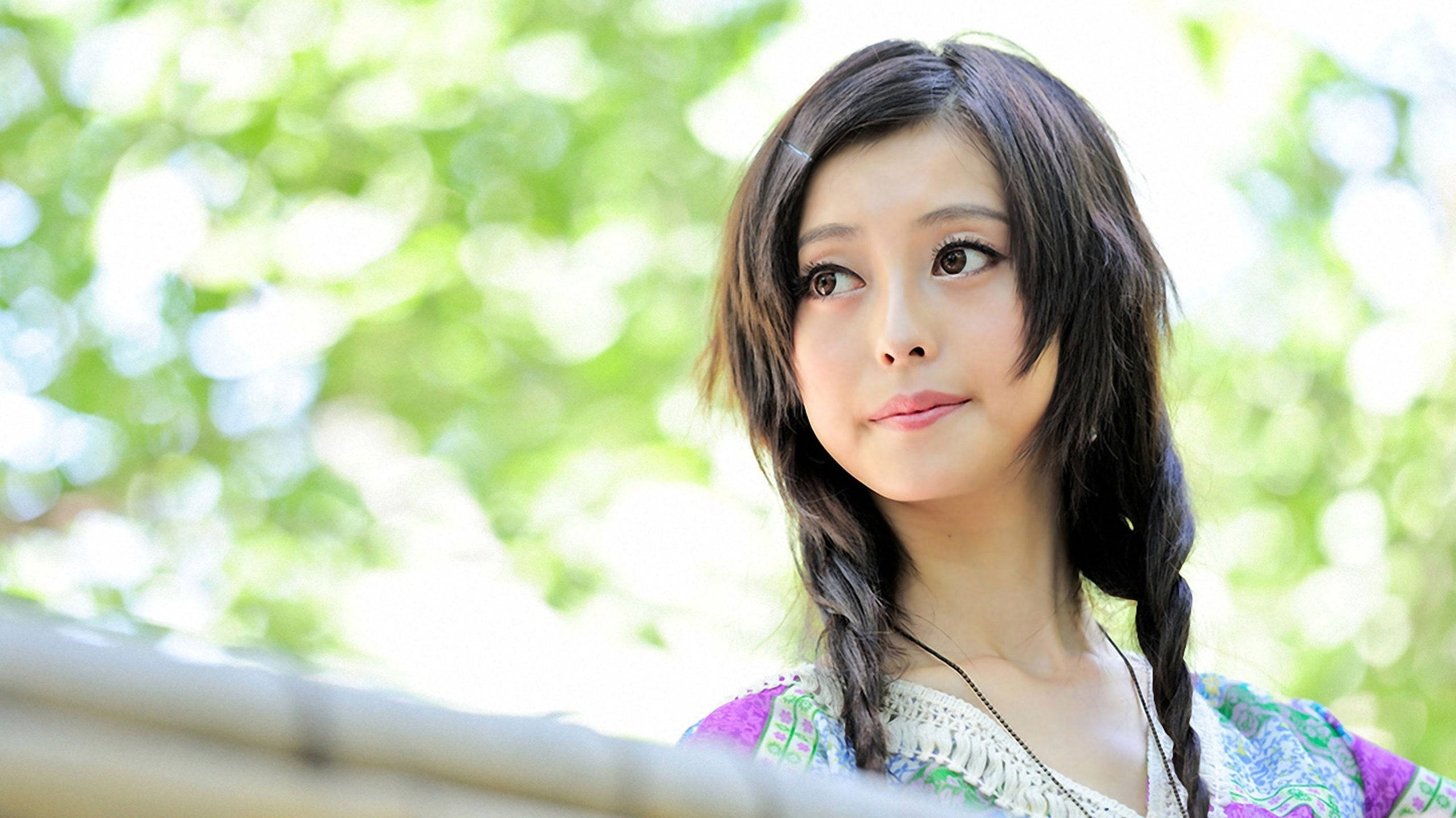 Japanese Girl With Braids, braided dark hair, bright green bokeh background, 2K Desktop Wallpaper
