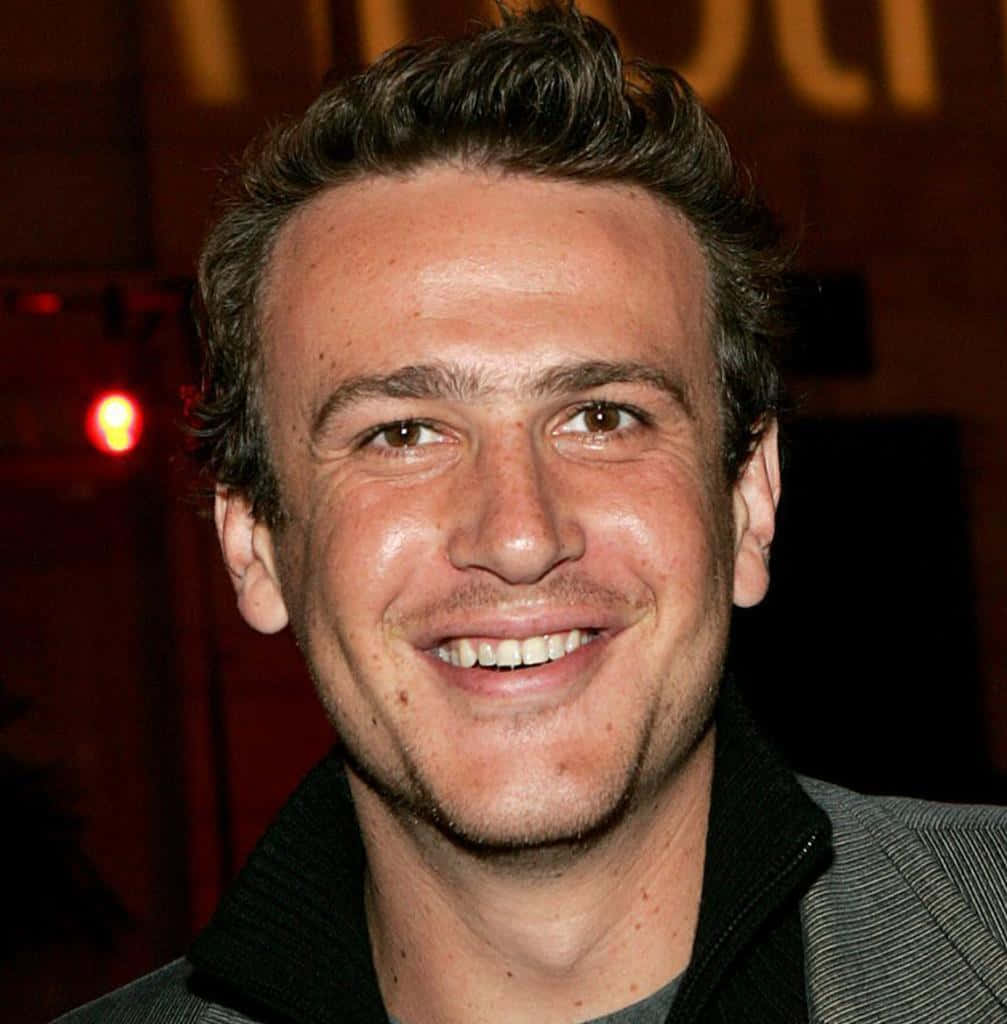 Jason Segel, gray jacket, dimly lit background, SD Phone Wallpaper