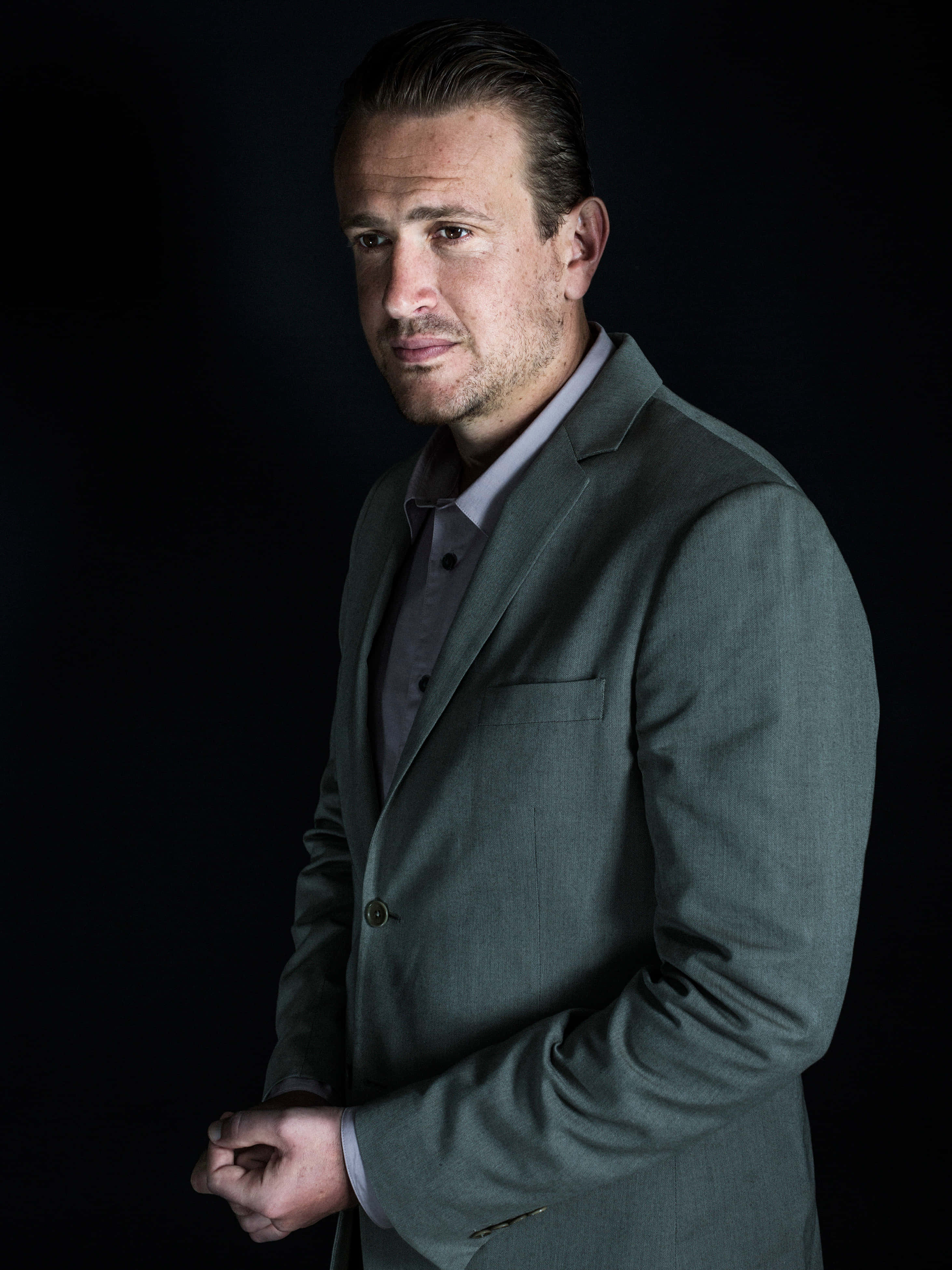 Jason Segel, gray suit, black background, 4K Phone Wallpaper