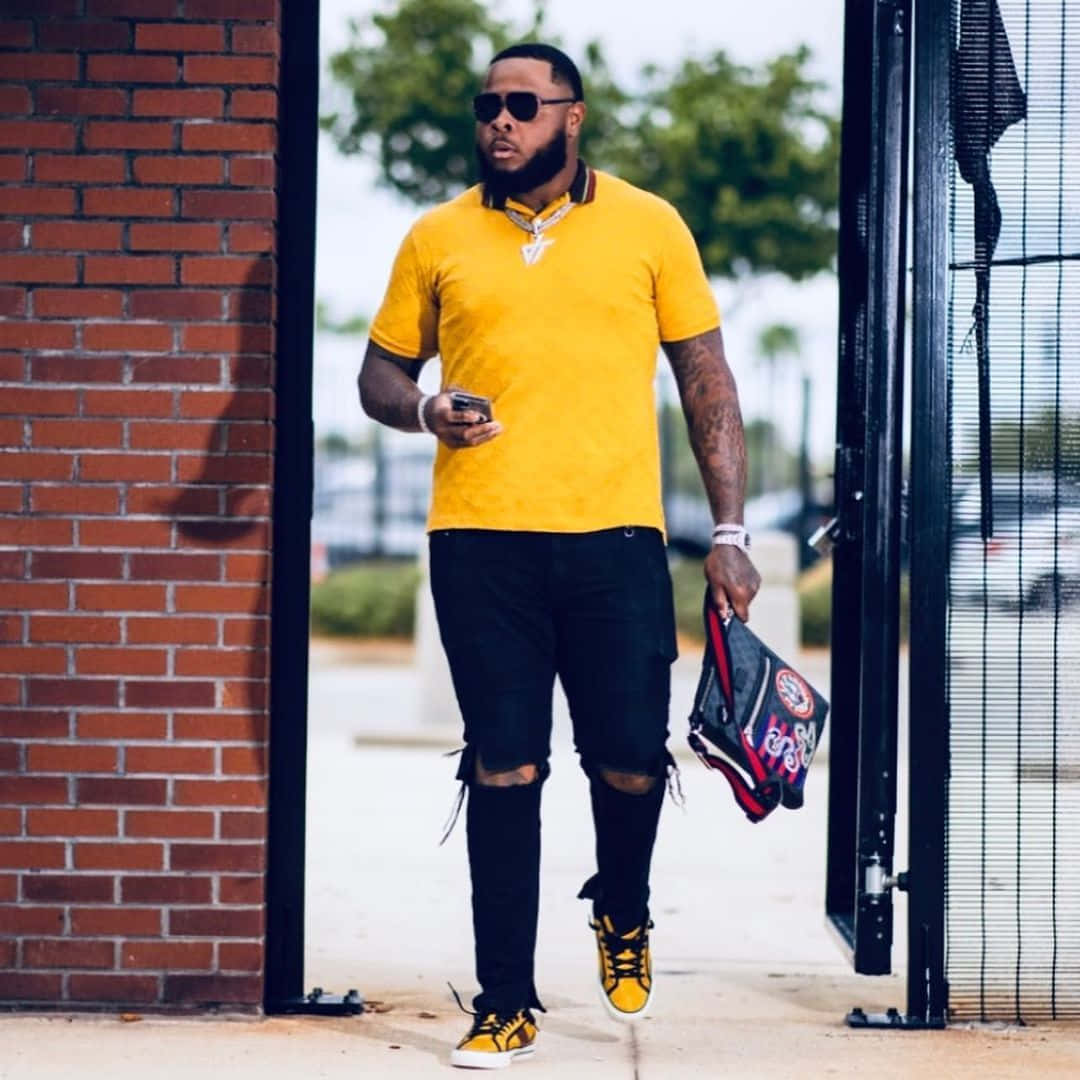 Jawaan Taylor, bright yellow polo, ripped black jeans, SD Desktop Wallpaper