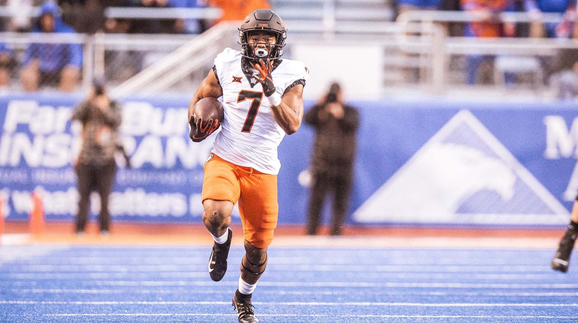 Jaylen Warren, white and orange uniform, blue turf field, Full HD Desktop Wallpaper