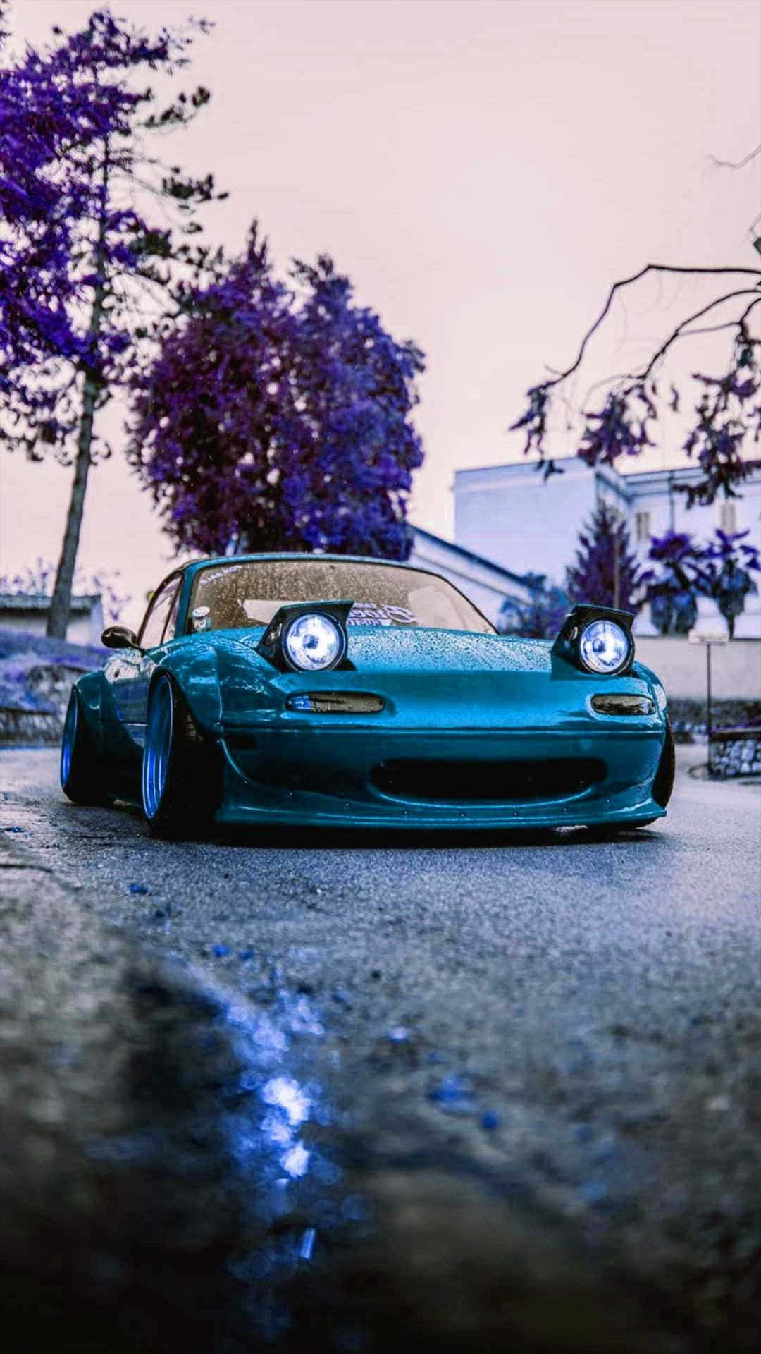 Jdm iPhone, teal sports car, glowing headlights, Full HD Phone Wallpaper