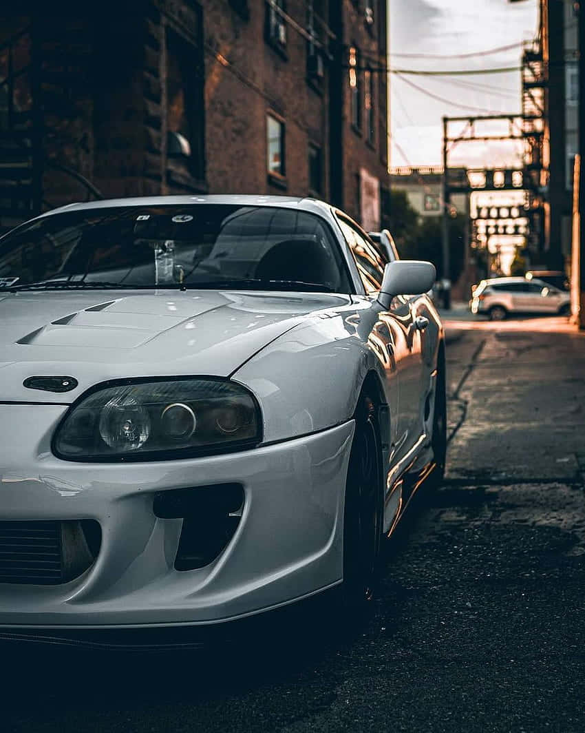 JDM Supra, white sports car, narrow urban alley, SD Phone Wallpaper