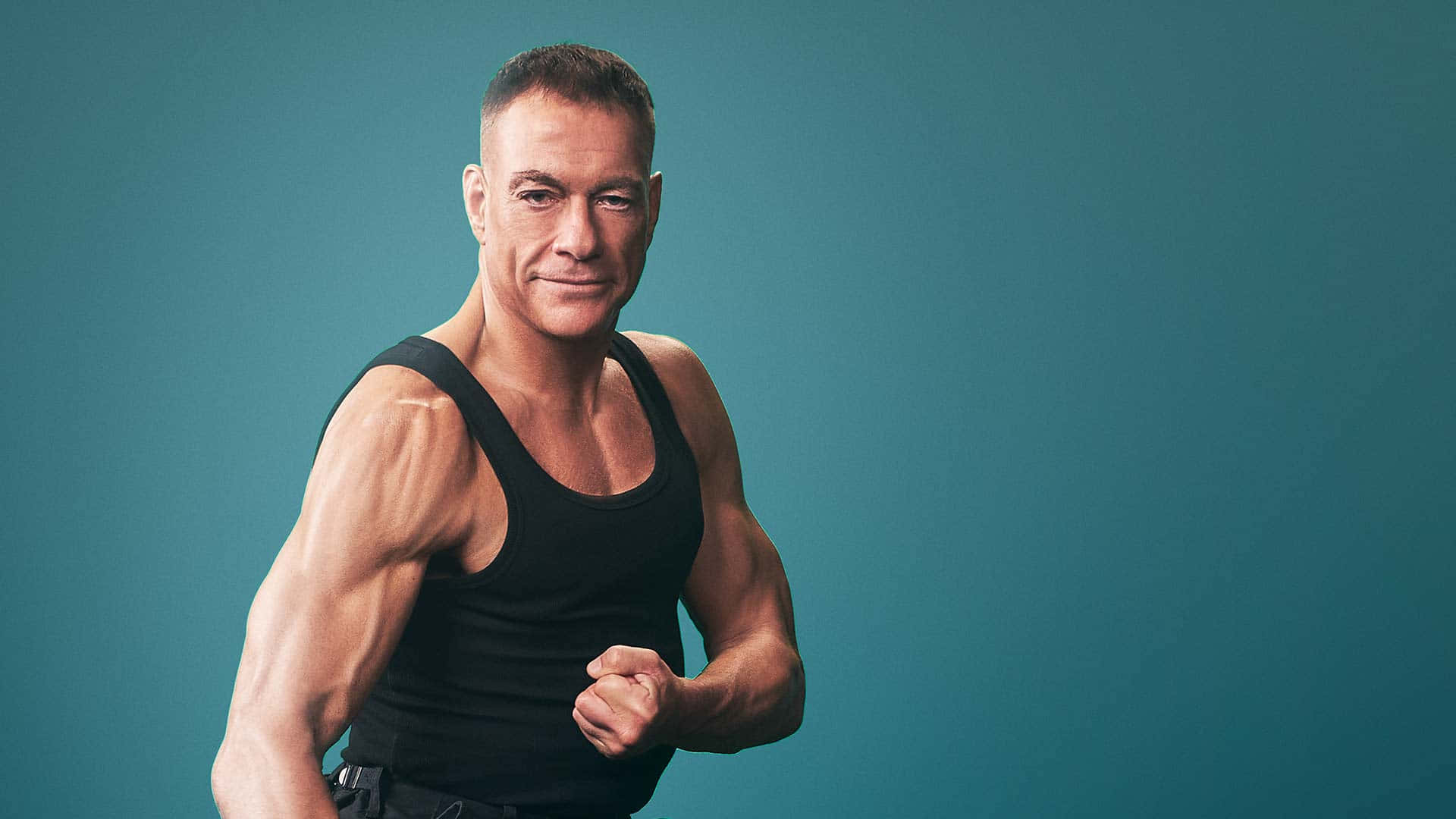 Jean Claude Van Damme, black tank top, teal studio background, Full HD Desktop Wallpaper