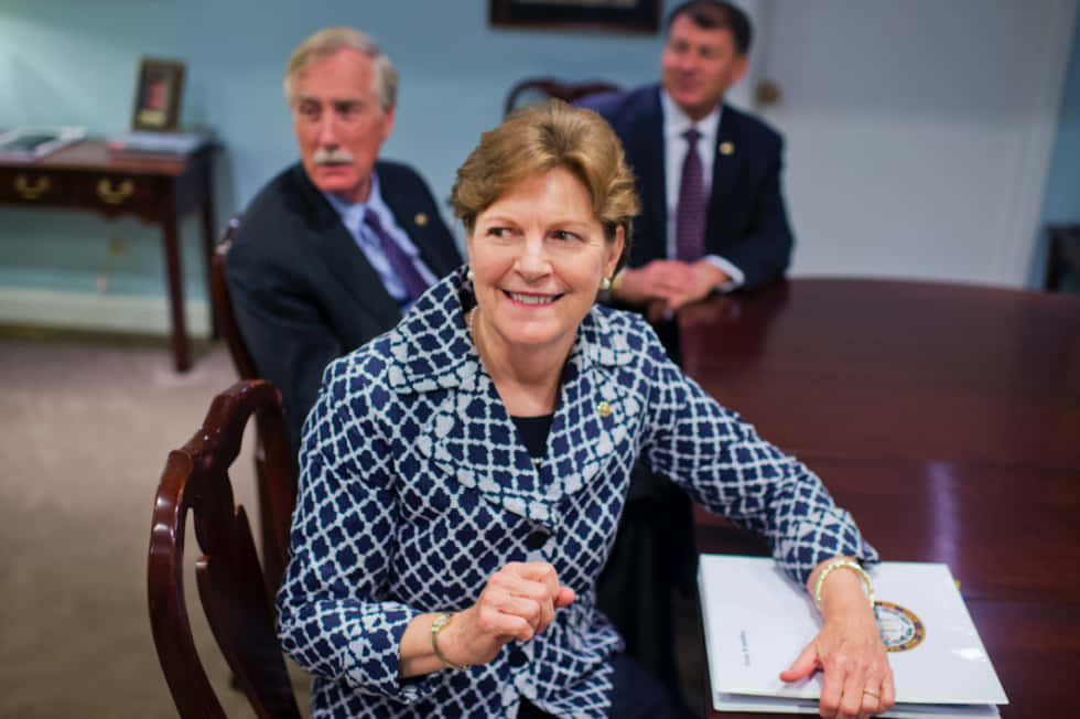 Jeanne Shaheen, blue patterned blazer, wooden table, SD Desktop Wallpaper