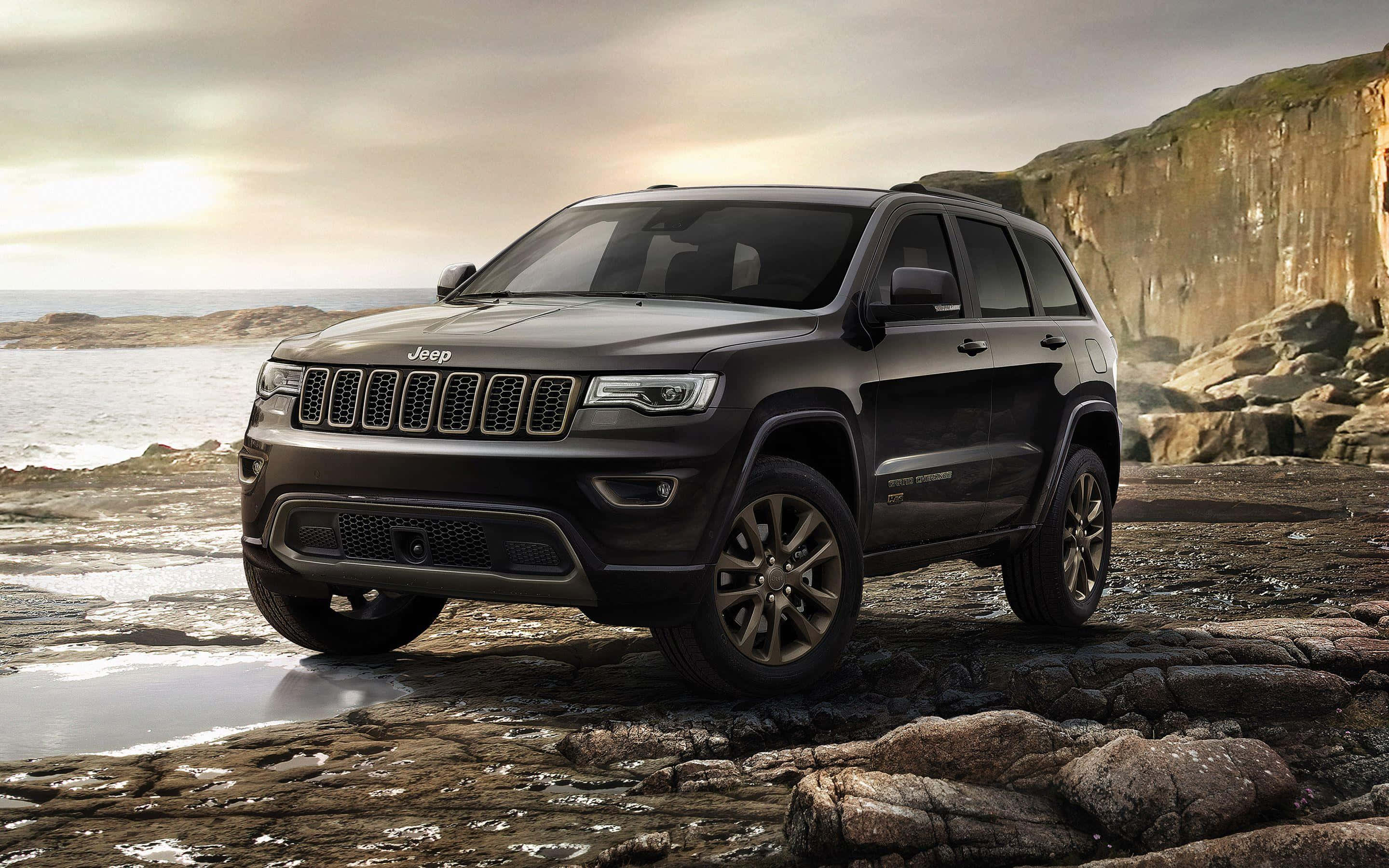 Jeep Grand Cherokee, black, wet coastal rocks, 2K Desktop Wallpaper