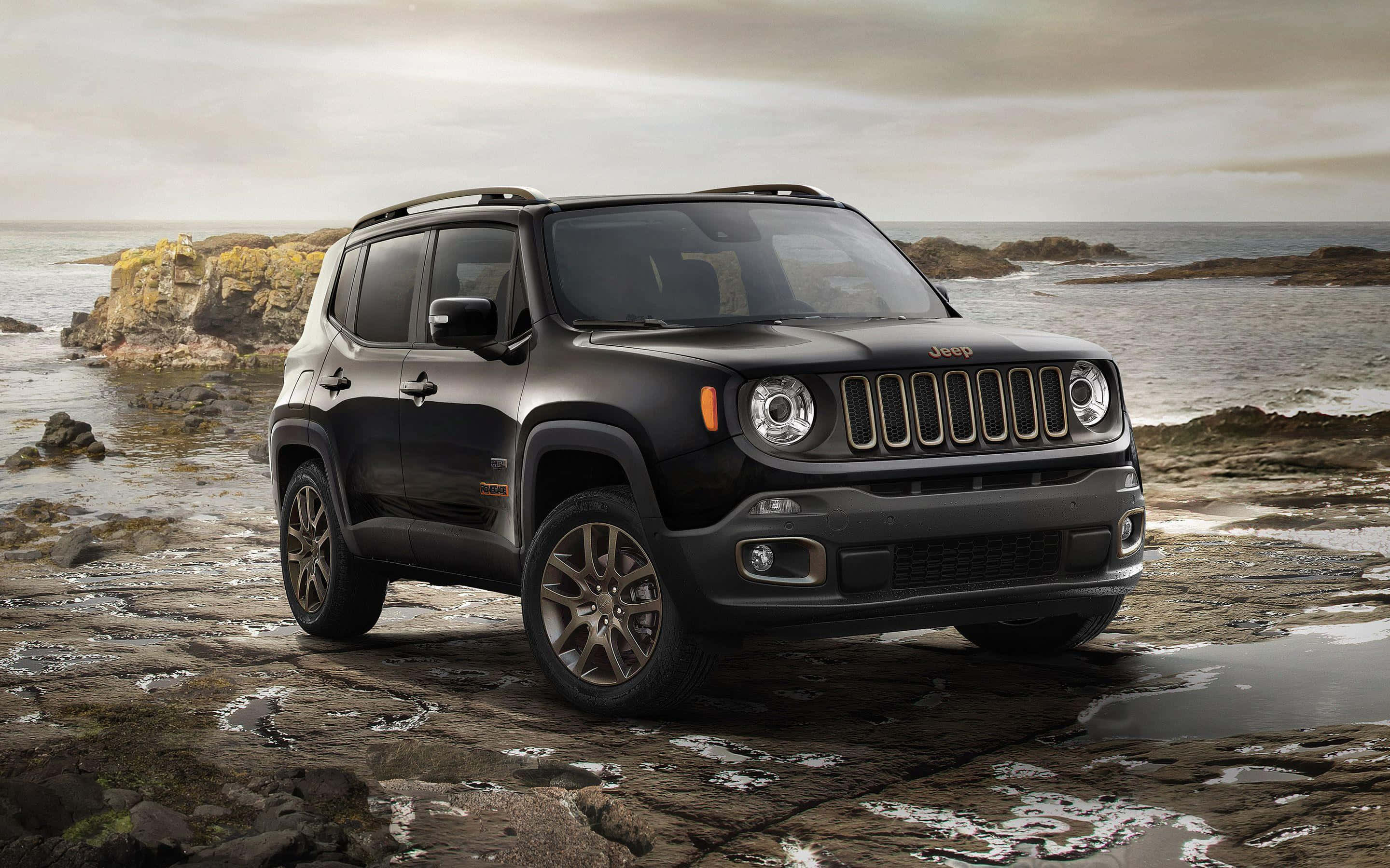 Jeep Renegade, black, wet coastal rocks, 2K Desktop Wallpaper