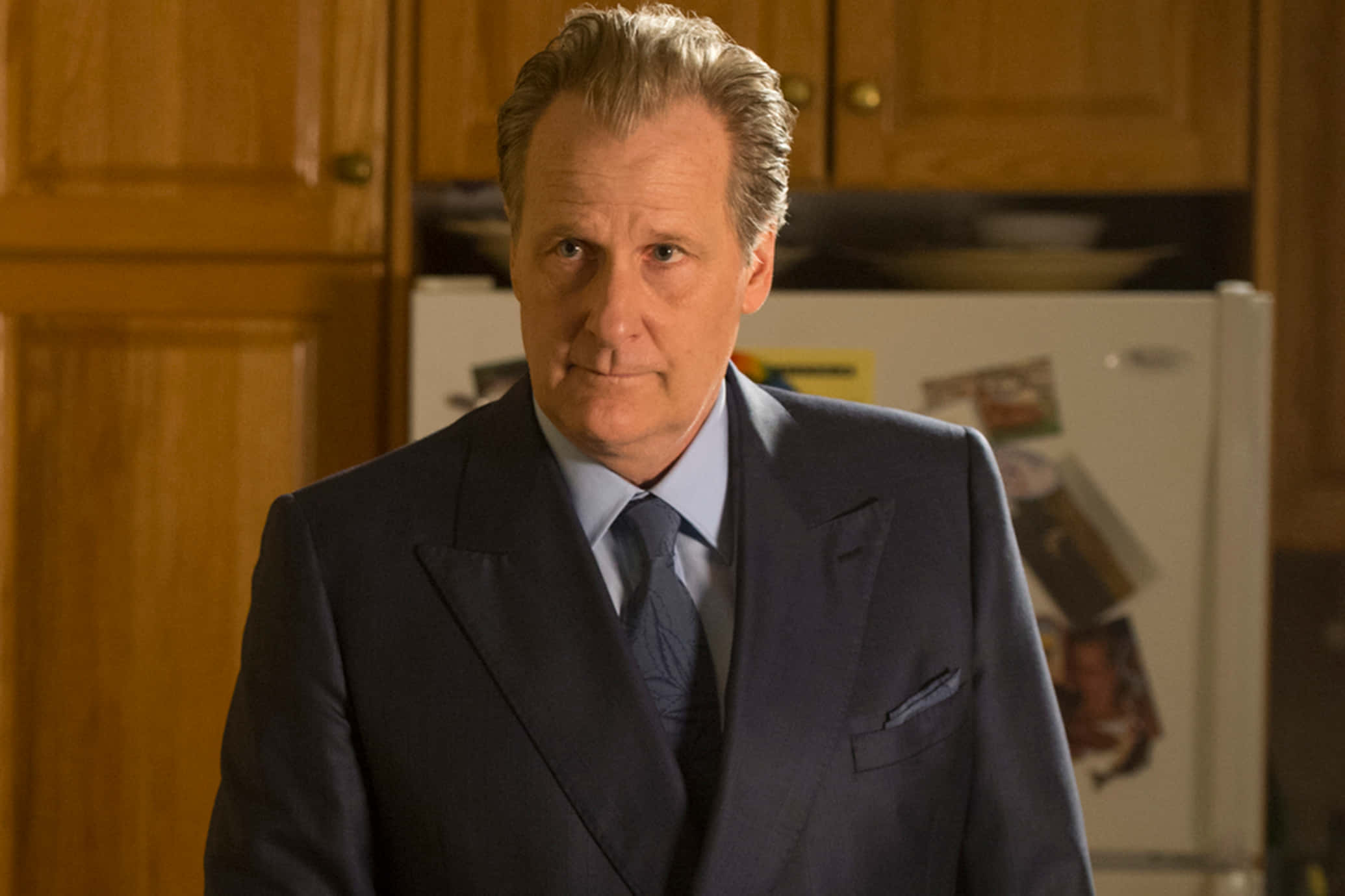 Jeff Daniels, dark suit, warmly lit kitchen, Full HD Desktop Wallpaper
