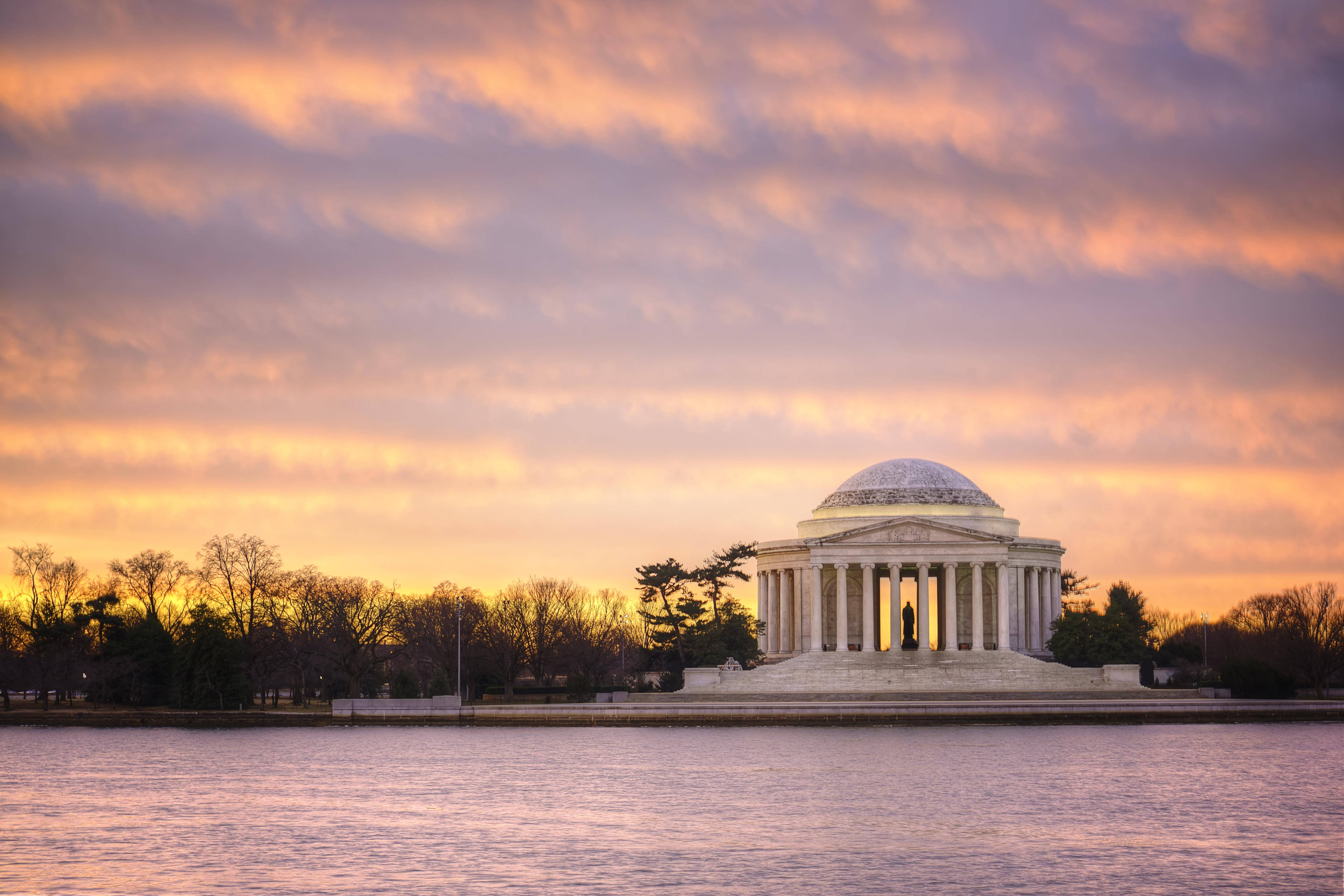 Jefferson Memorial, golden sunset light, vibrant orange clouds, 5K Desktop Wallpaper
