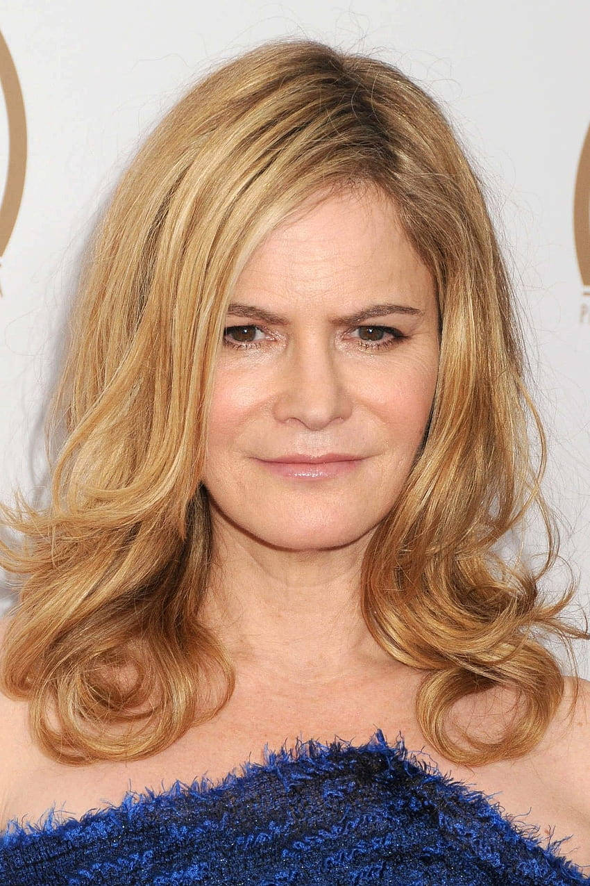 Jennifer Jason Leigh, wavy blonde hair, textured blue off-shoulder top, SD Phone Wallpaper